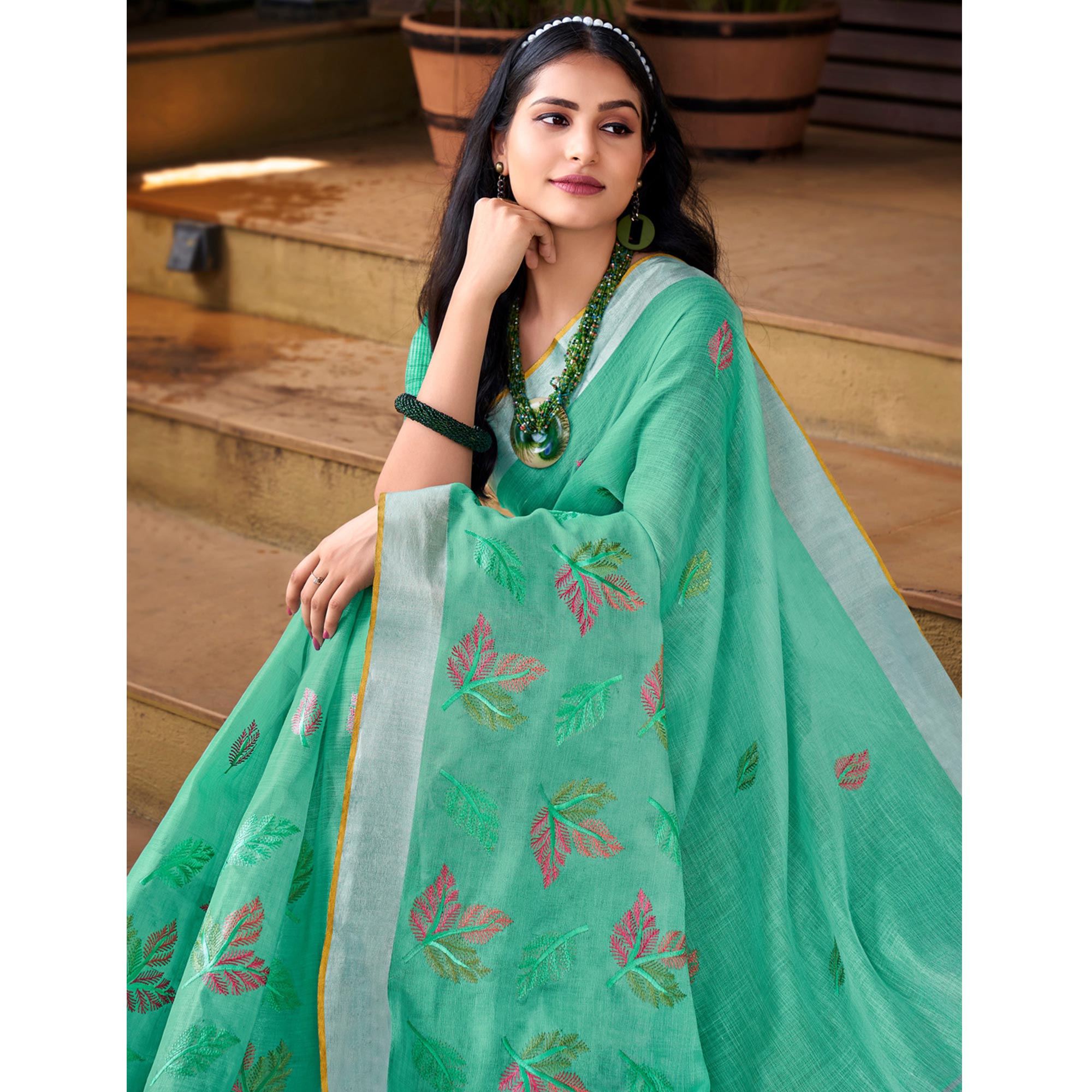Sea Green Floral Embroidered Linen Saree With Tassels