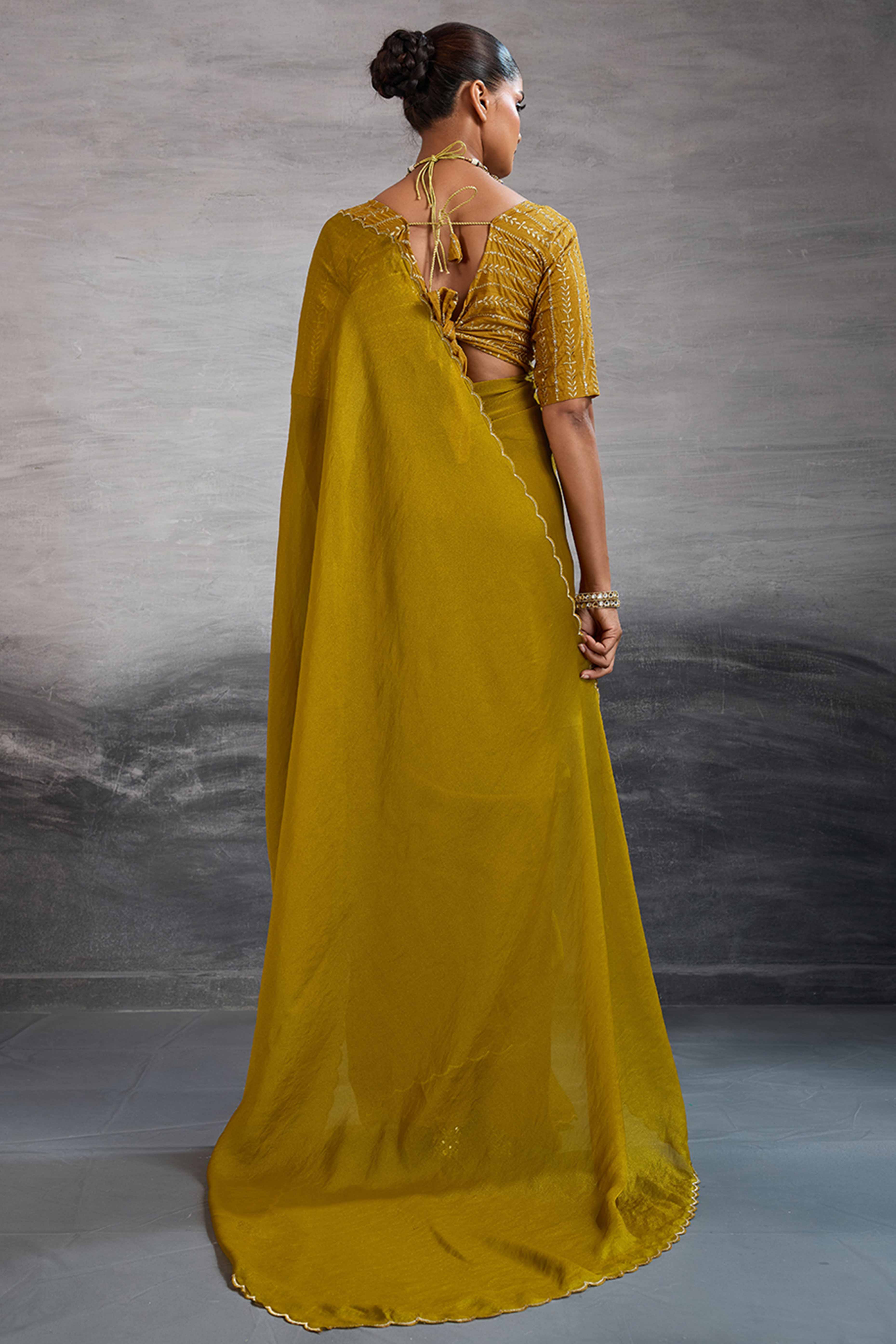 Mustard Solid Organza Jimmy Choo Saree Accentuated With Elegant Cutwork Border Detailing