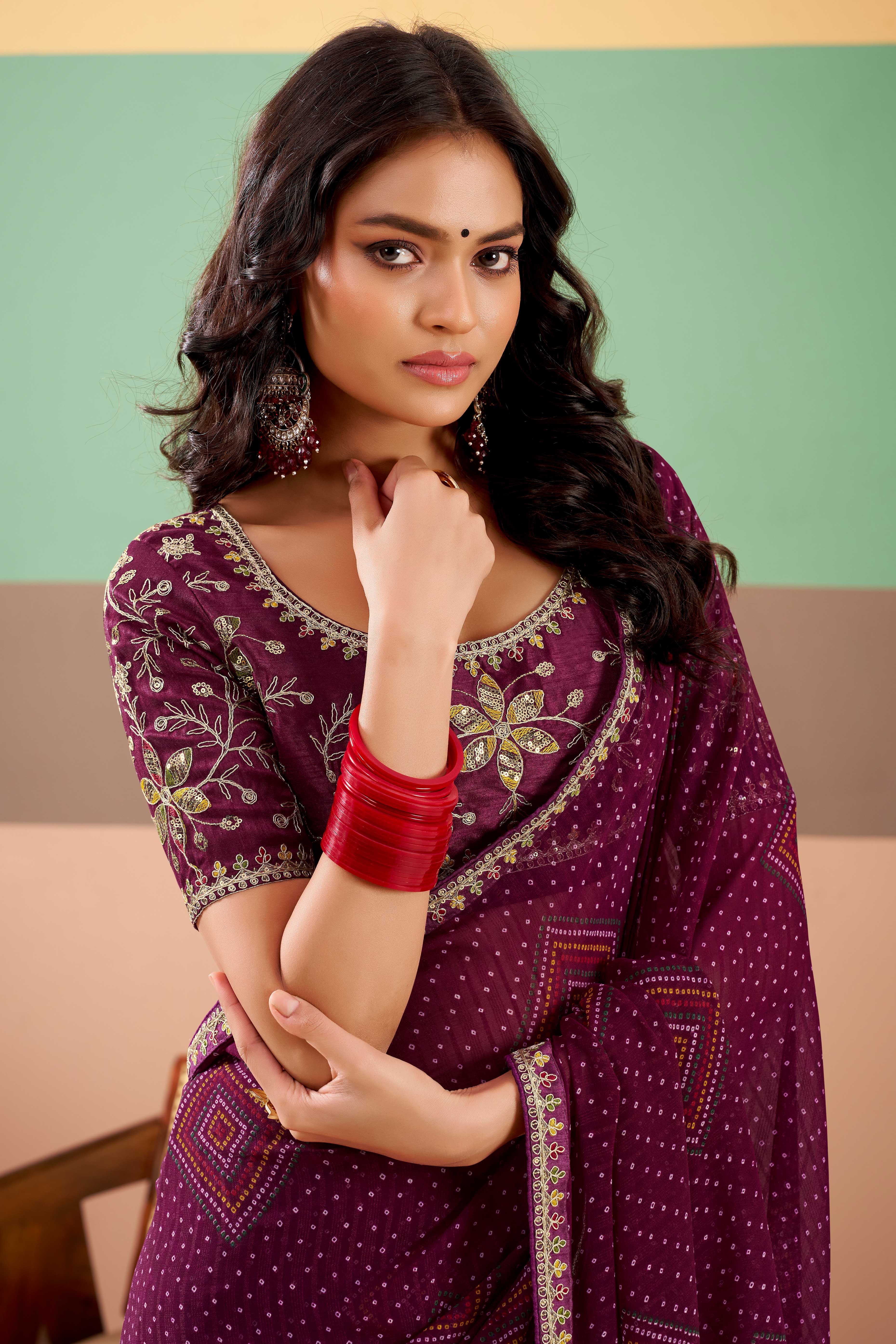 Charming Wine Bandhani Printed Georgette Saree Adorned With Intricate Cording Embroidered Border