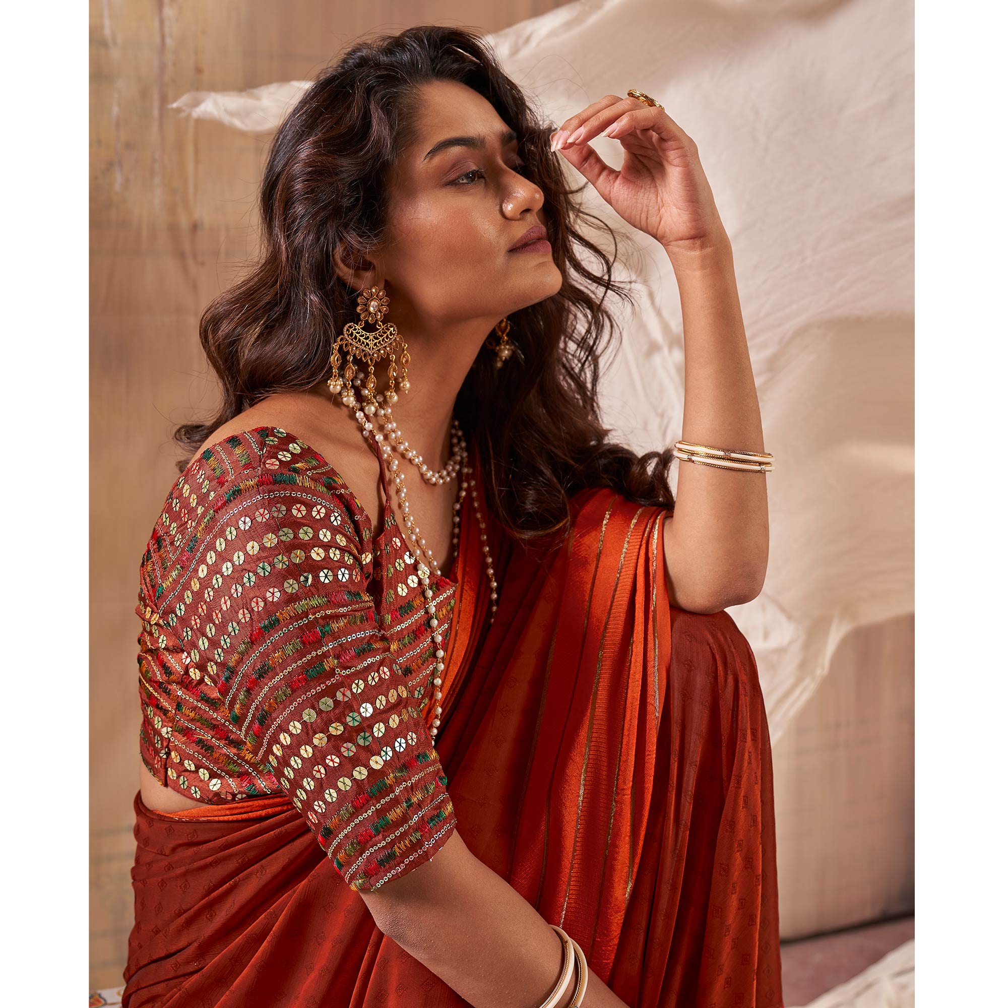 Rust Woven Georgette Saree With Tassels