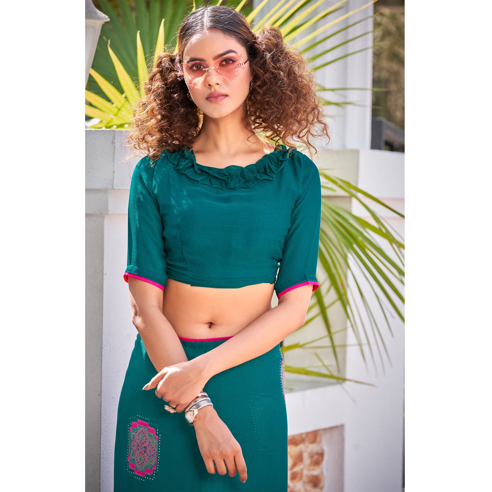 Teal Foil Printed Georgette Saree With Tassels