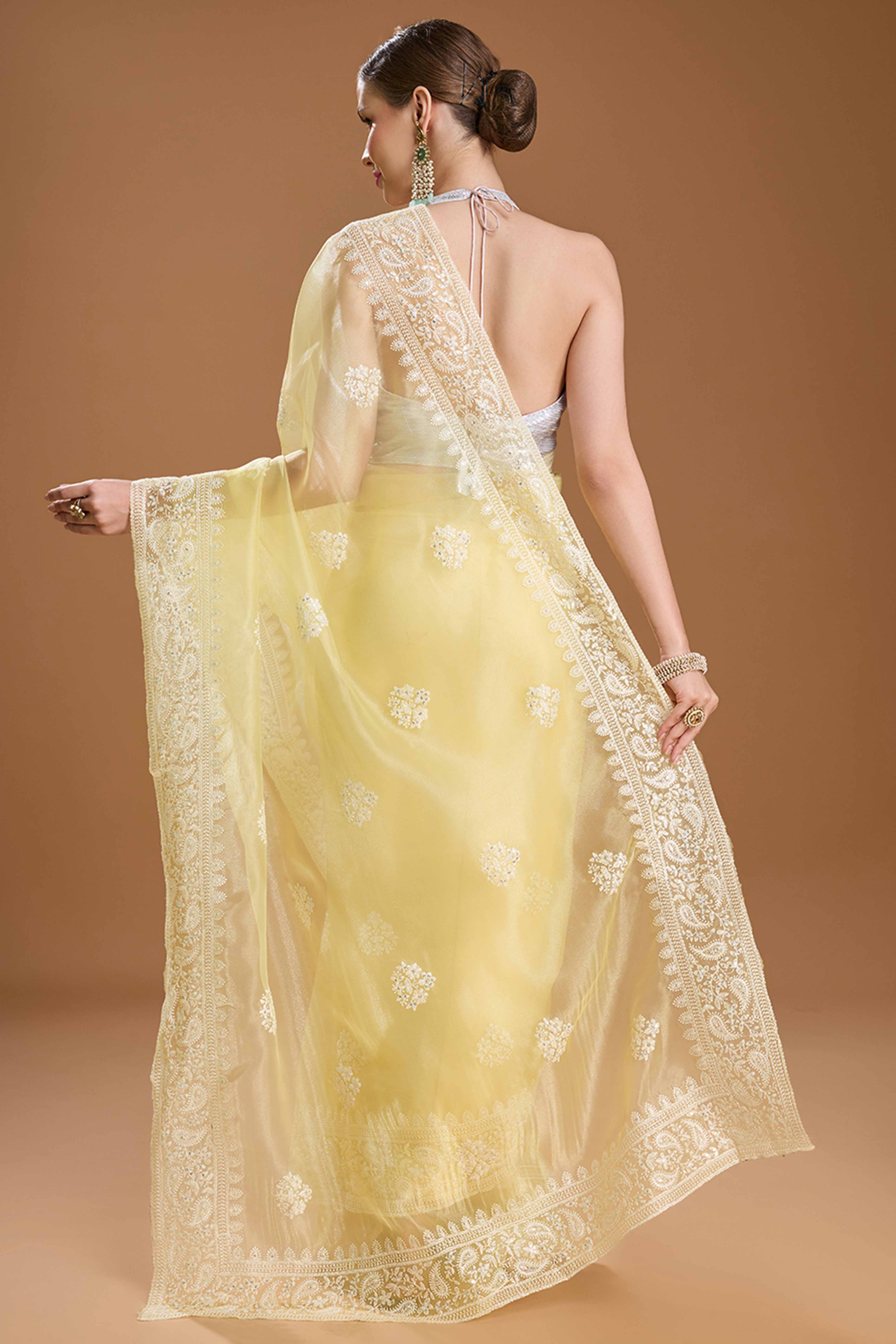 Light Yellow Net Saree Enhanced with Elegant Sequins Embellishments