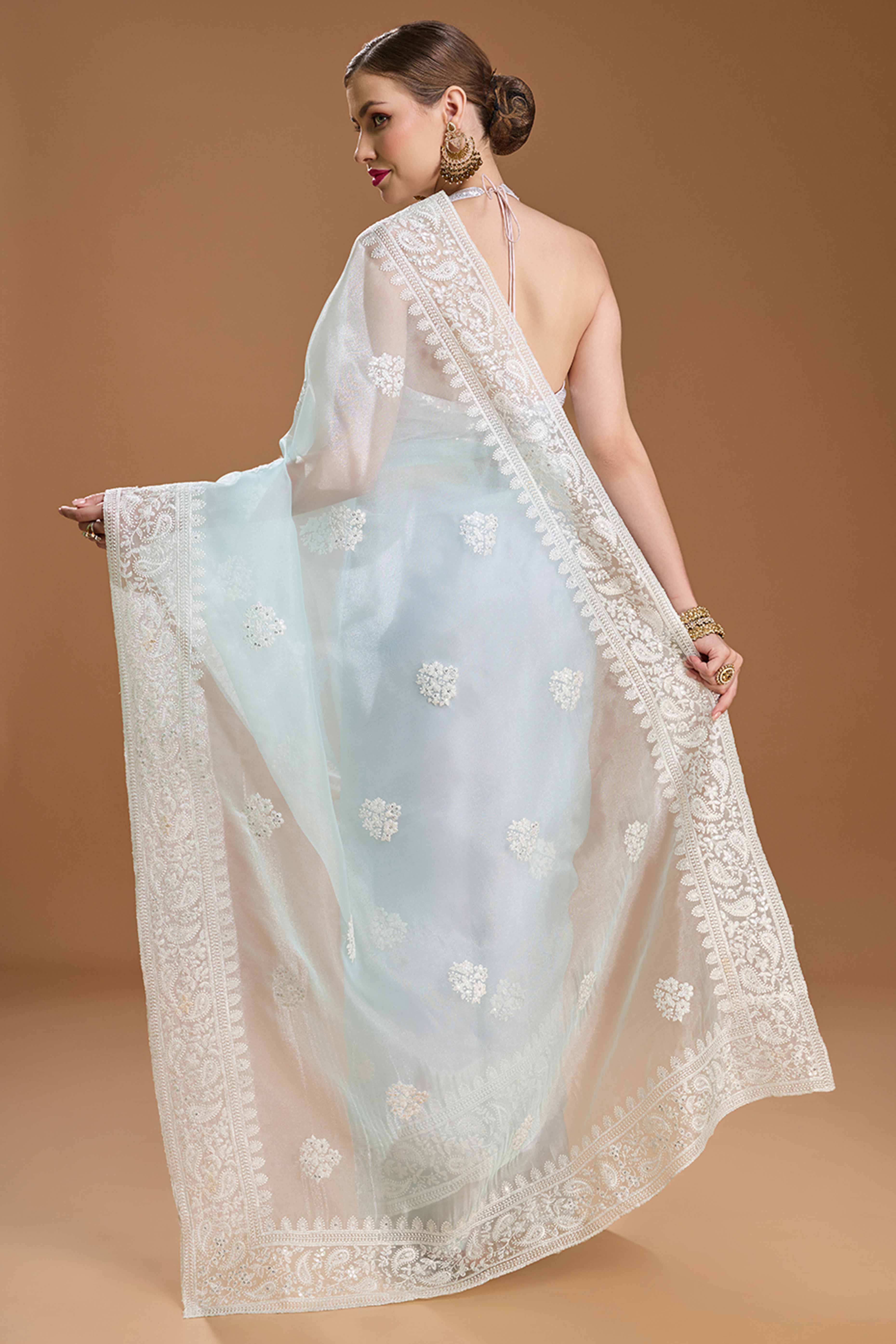 Mint Green Net Saree Enhanced with Elegant Sequins Embellishments