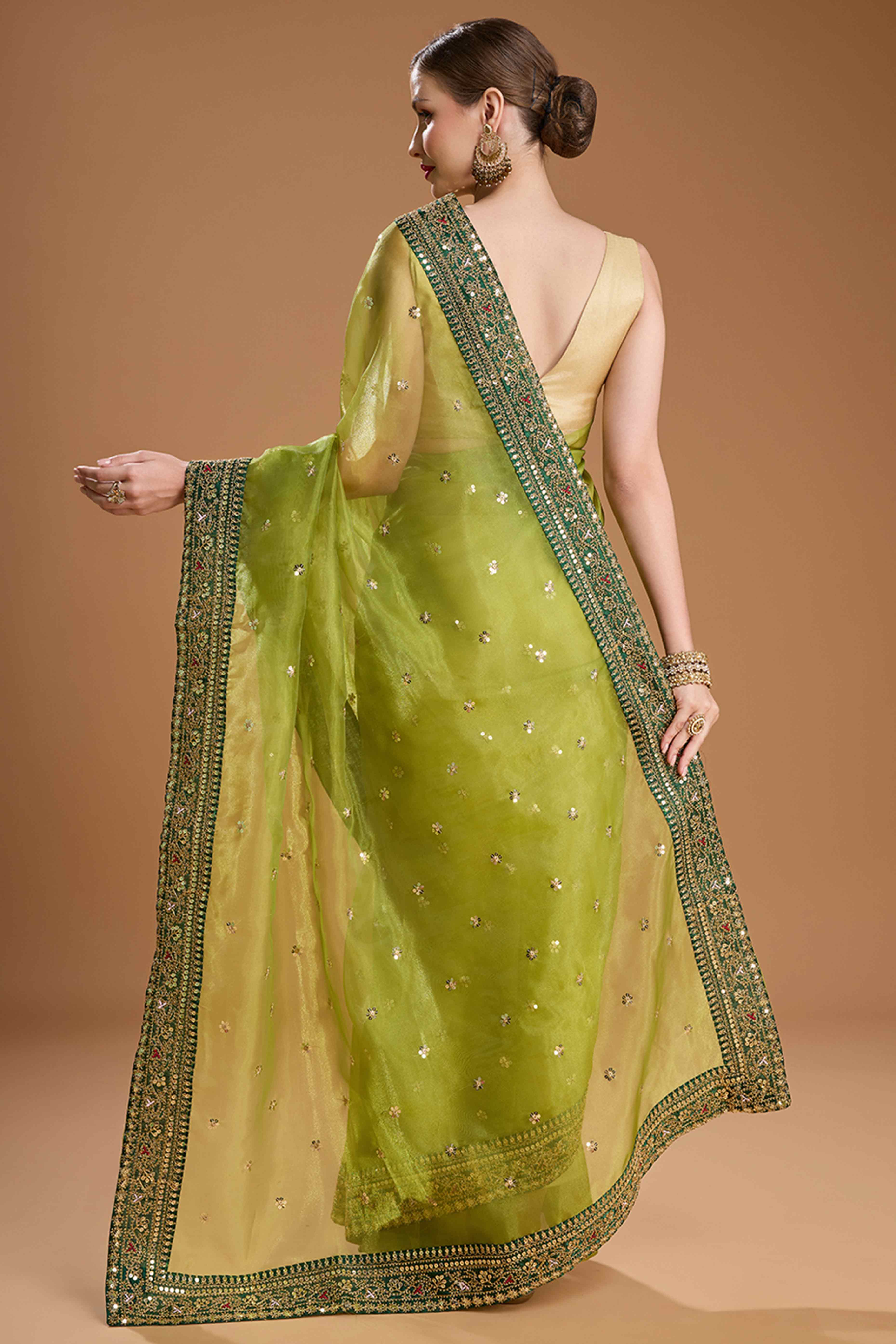 Green Organza Saree Enhanced with Elegant Sequins Embellishments