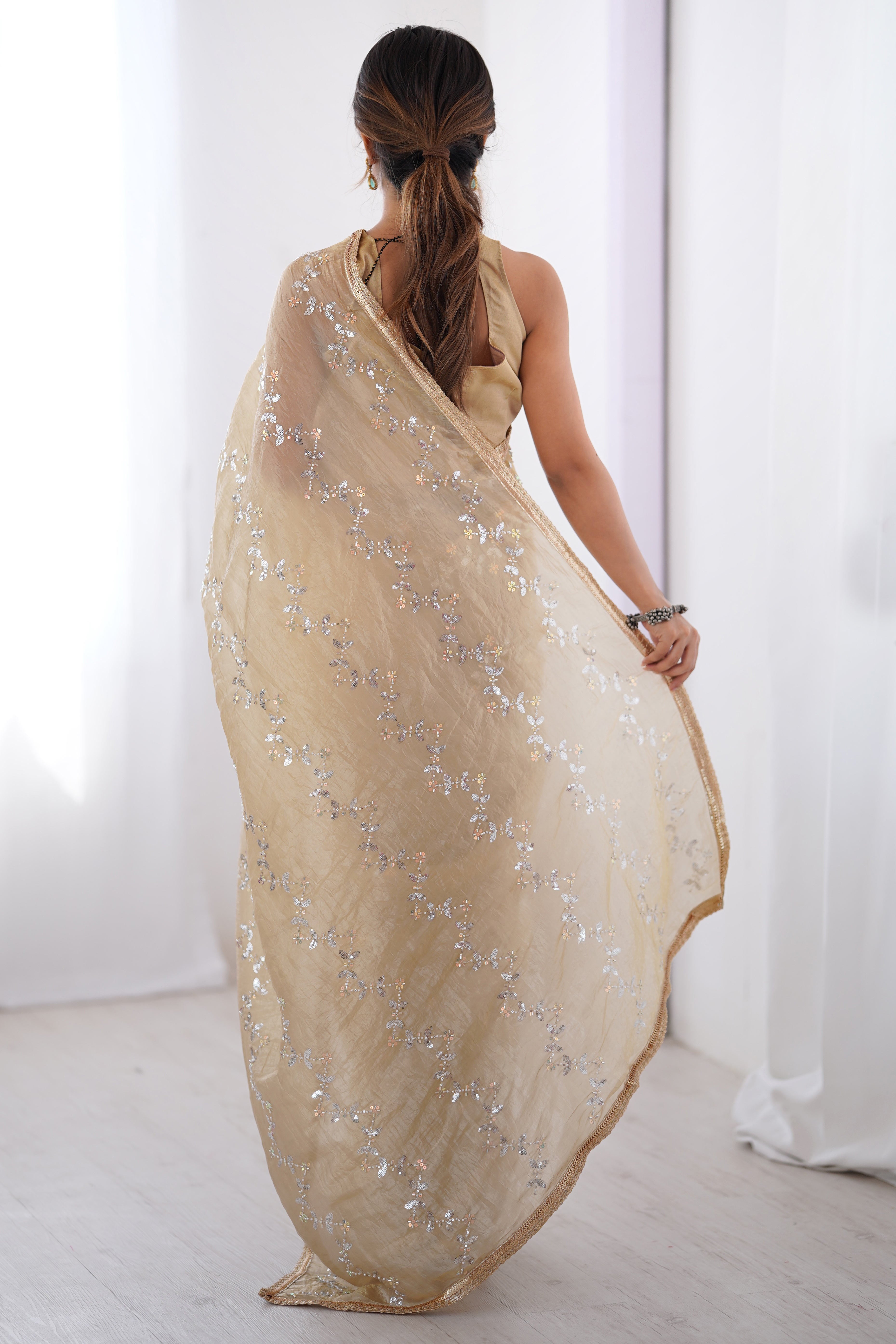 Dazzling Beige Organza Saree Accented with Sequin, Bead & Stone Work and Delicate Lace Detailing