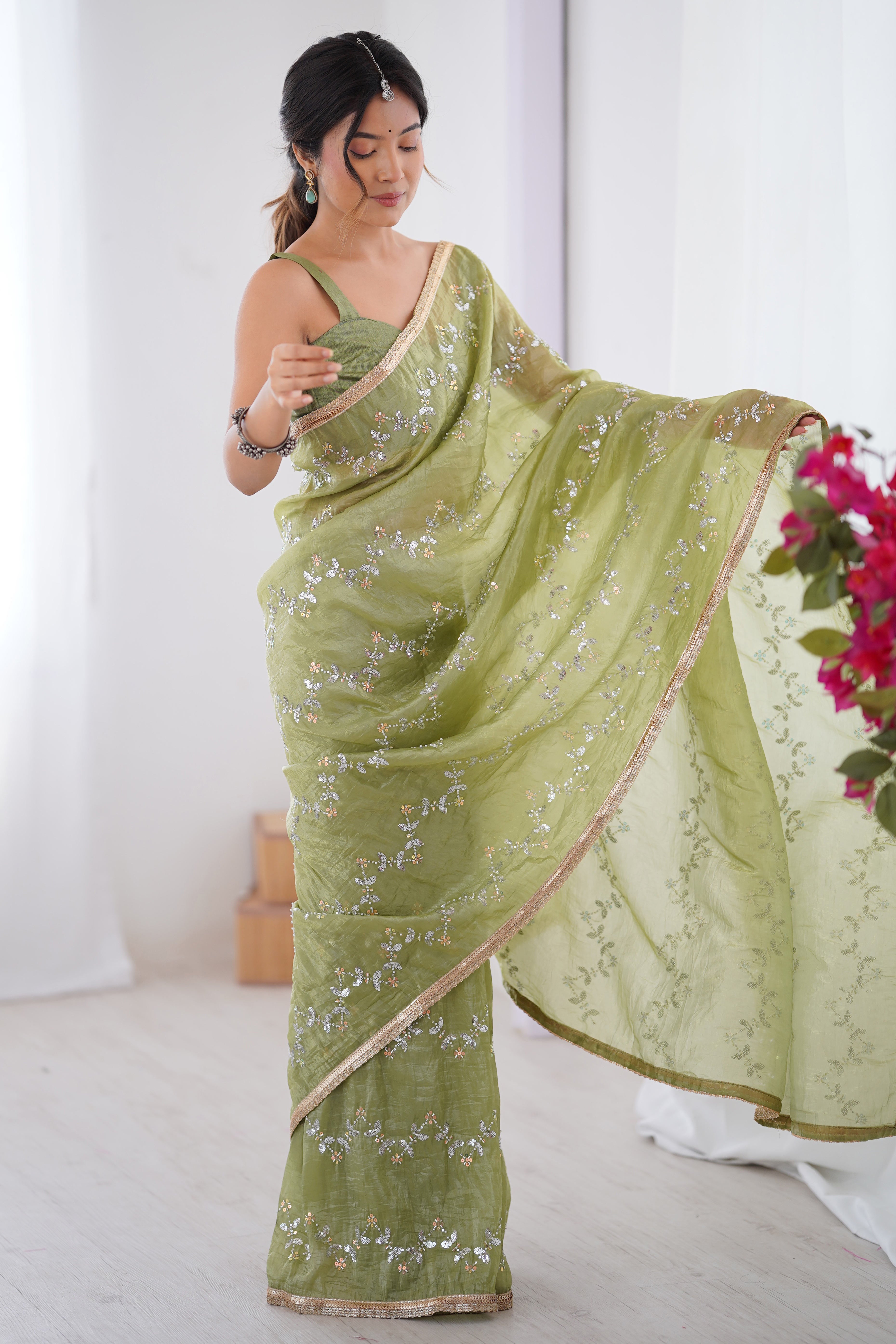 Dazzling Pista Green Organza Saree Accented with Sequin, Bead & Stone Work and Delicate Lace Detailing