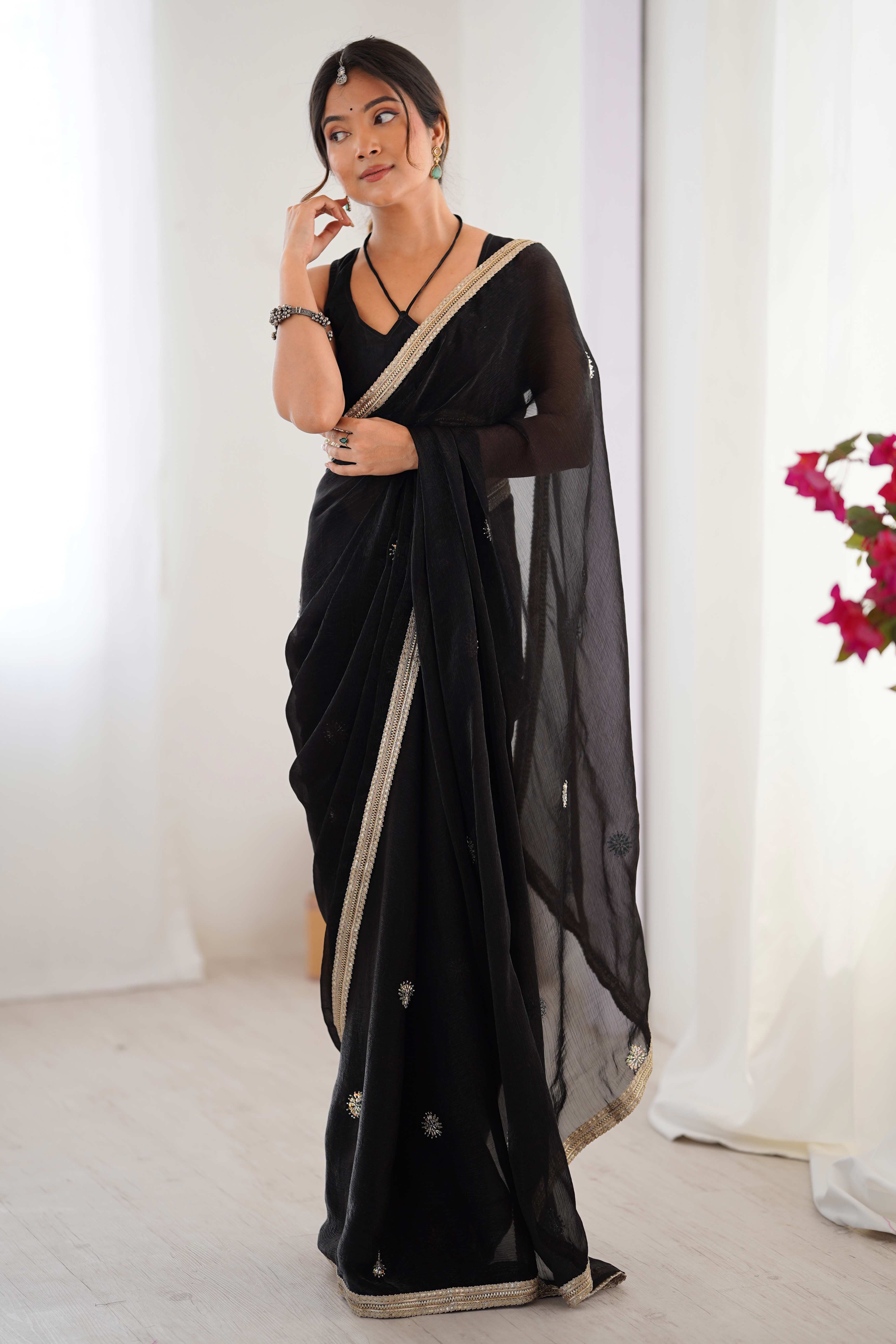 Elegant Black Organza Saree with Delicate Floral Embellishments and Lace Border