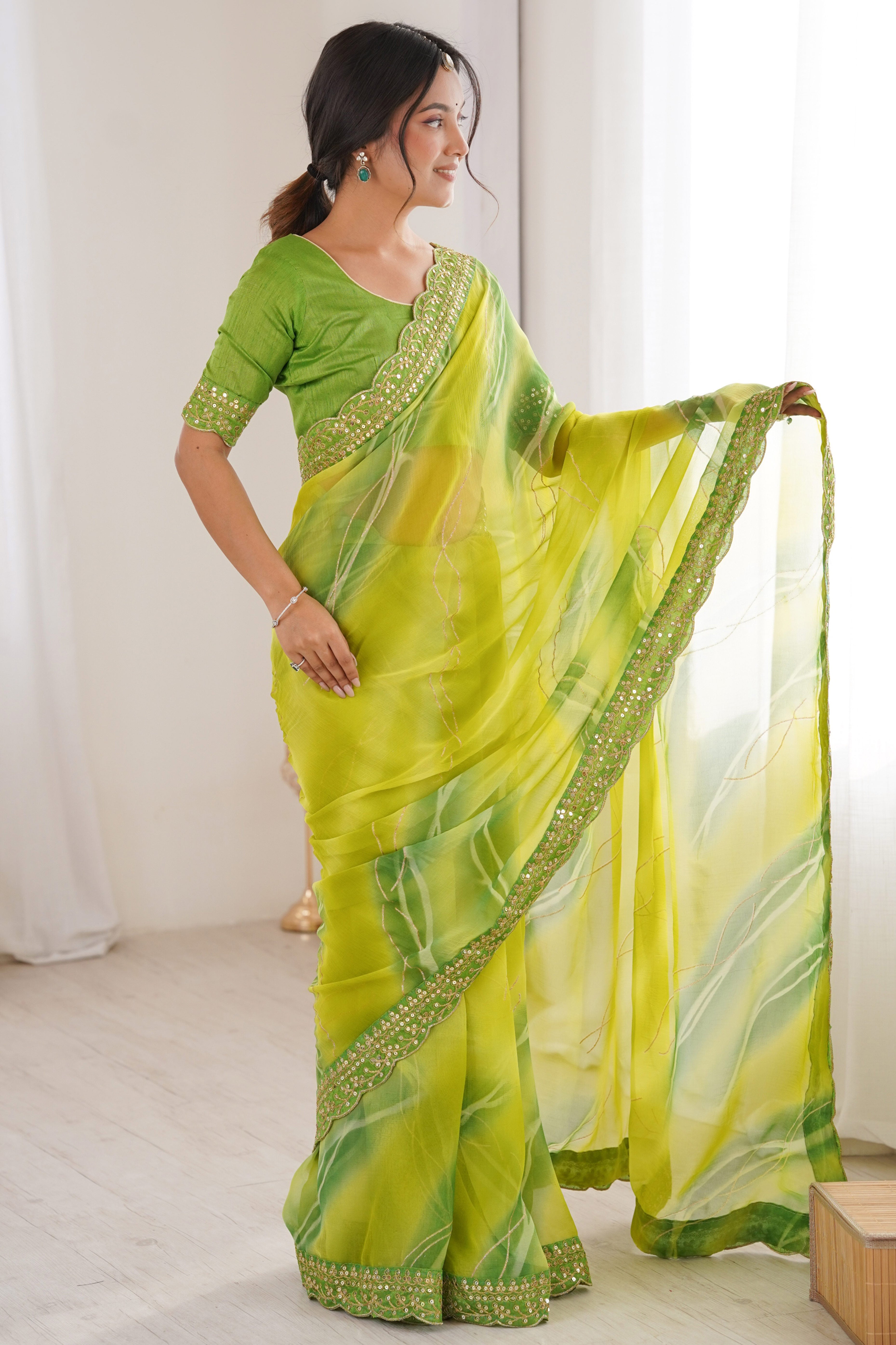 Graceful Green Foil Print Georgette Saree Featuring A Luxurious Cording Sequins Embroidered Border