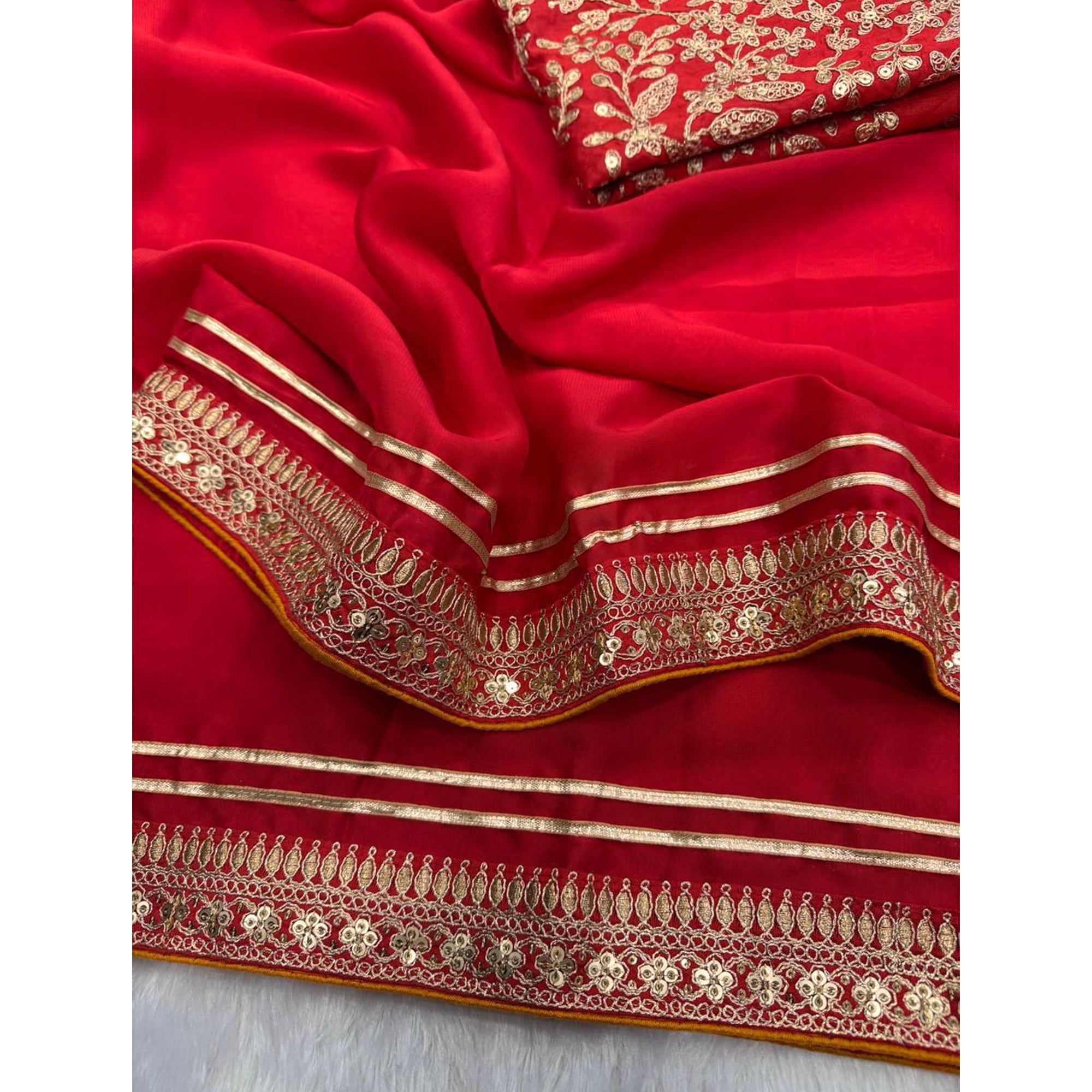 Red Festive Silk Blend Saree Highlighted with Silver Thread Work and Shimmering Sequins