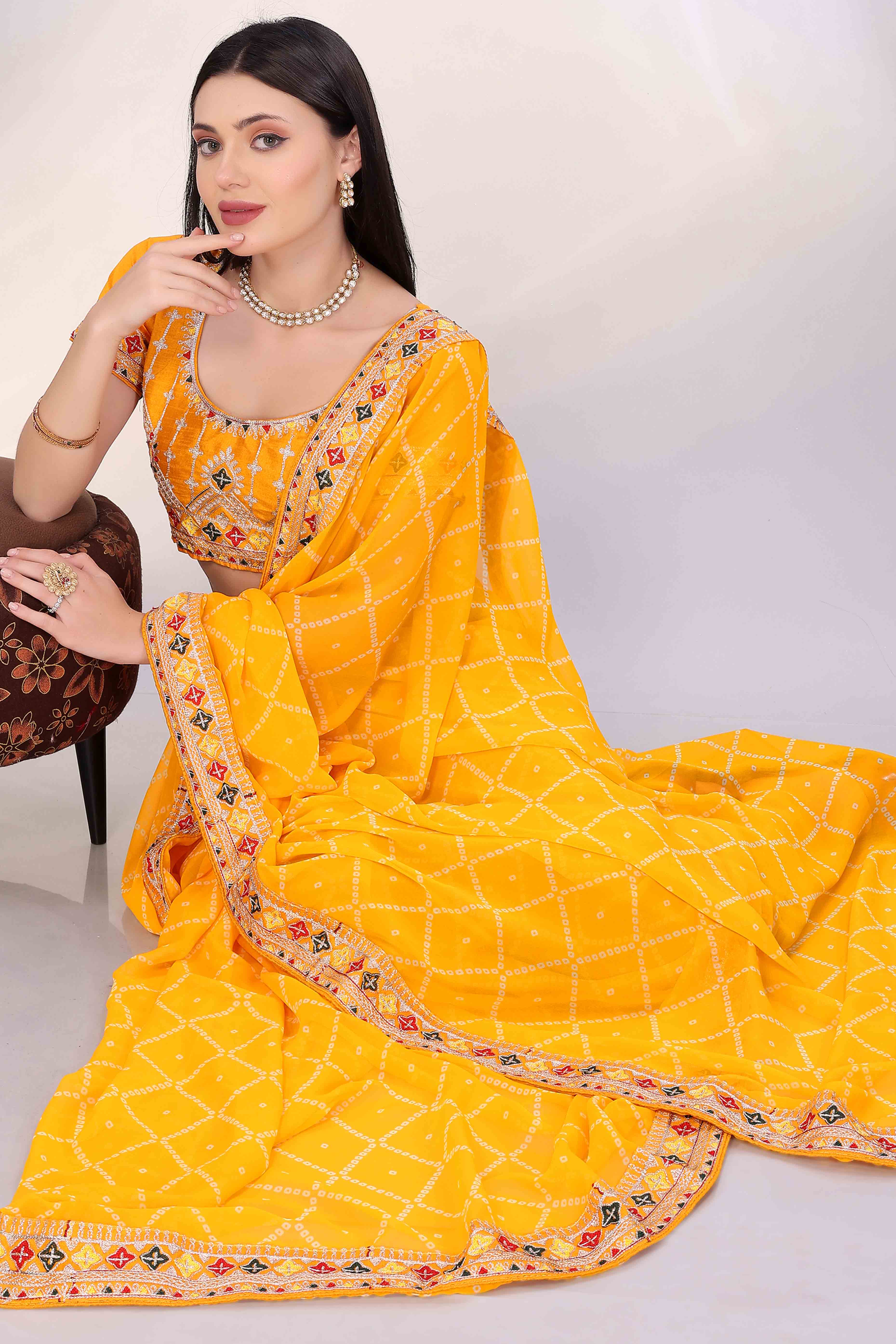 Yellow Bandhani Printed Georgette Saree Framed With Elegant Embroidered Border