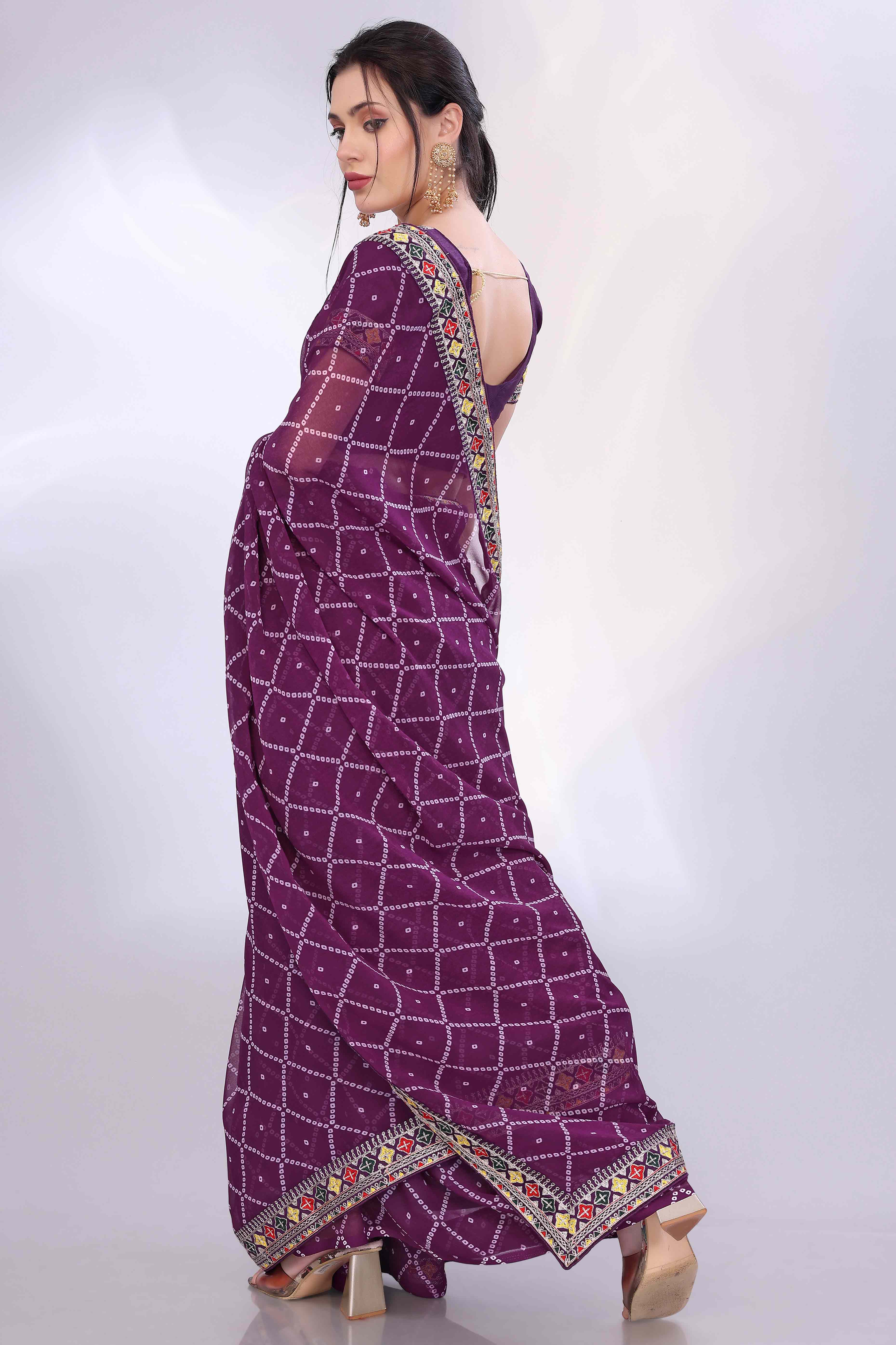 Wine Bandhani Printed Georgette Saree Framed With Elegant Embroidered Border