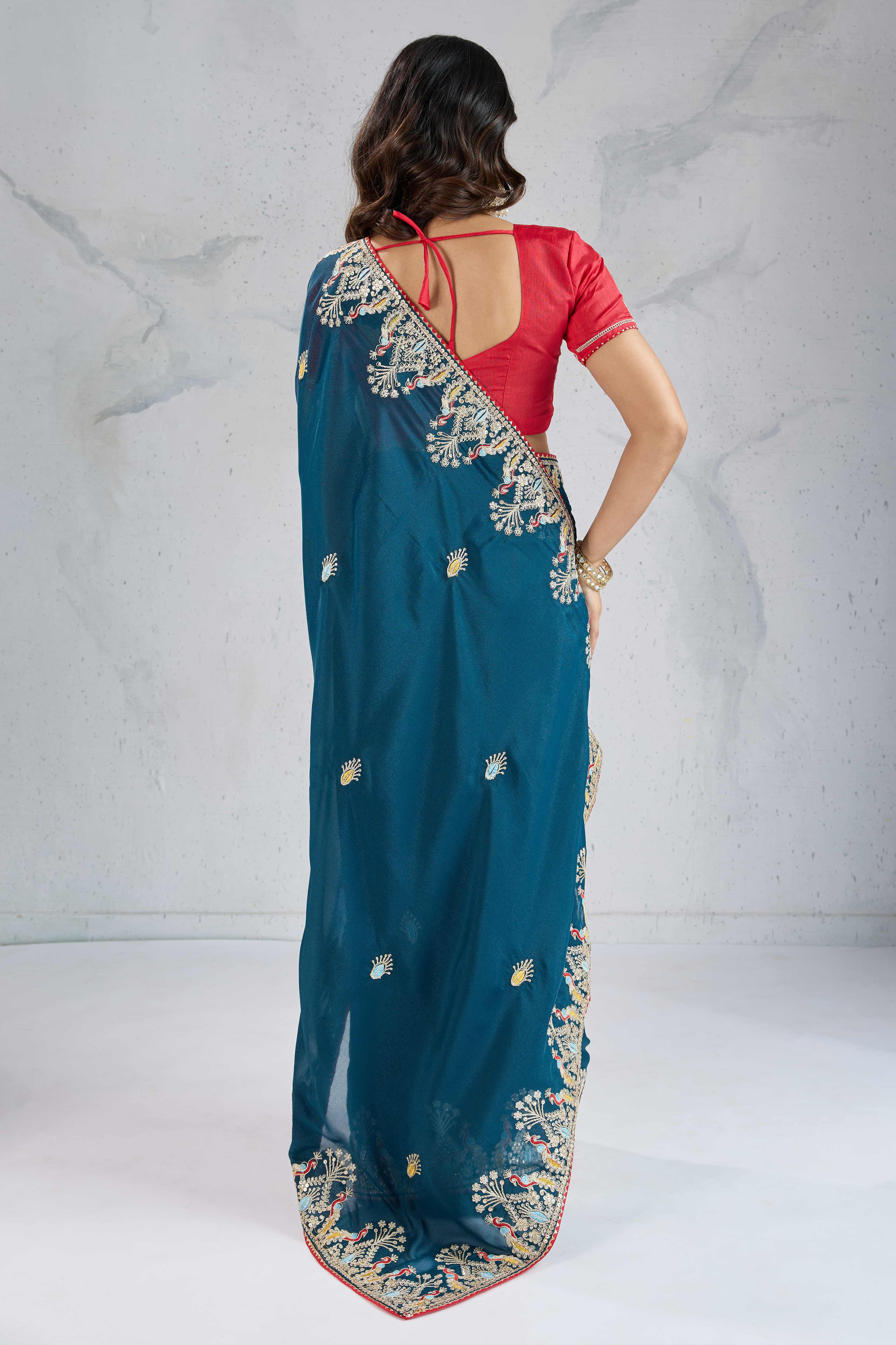 Teal Embroidered Saree with Ethnic Detailing in Georgette Fabric