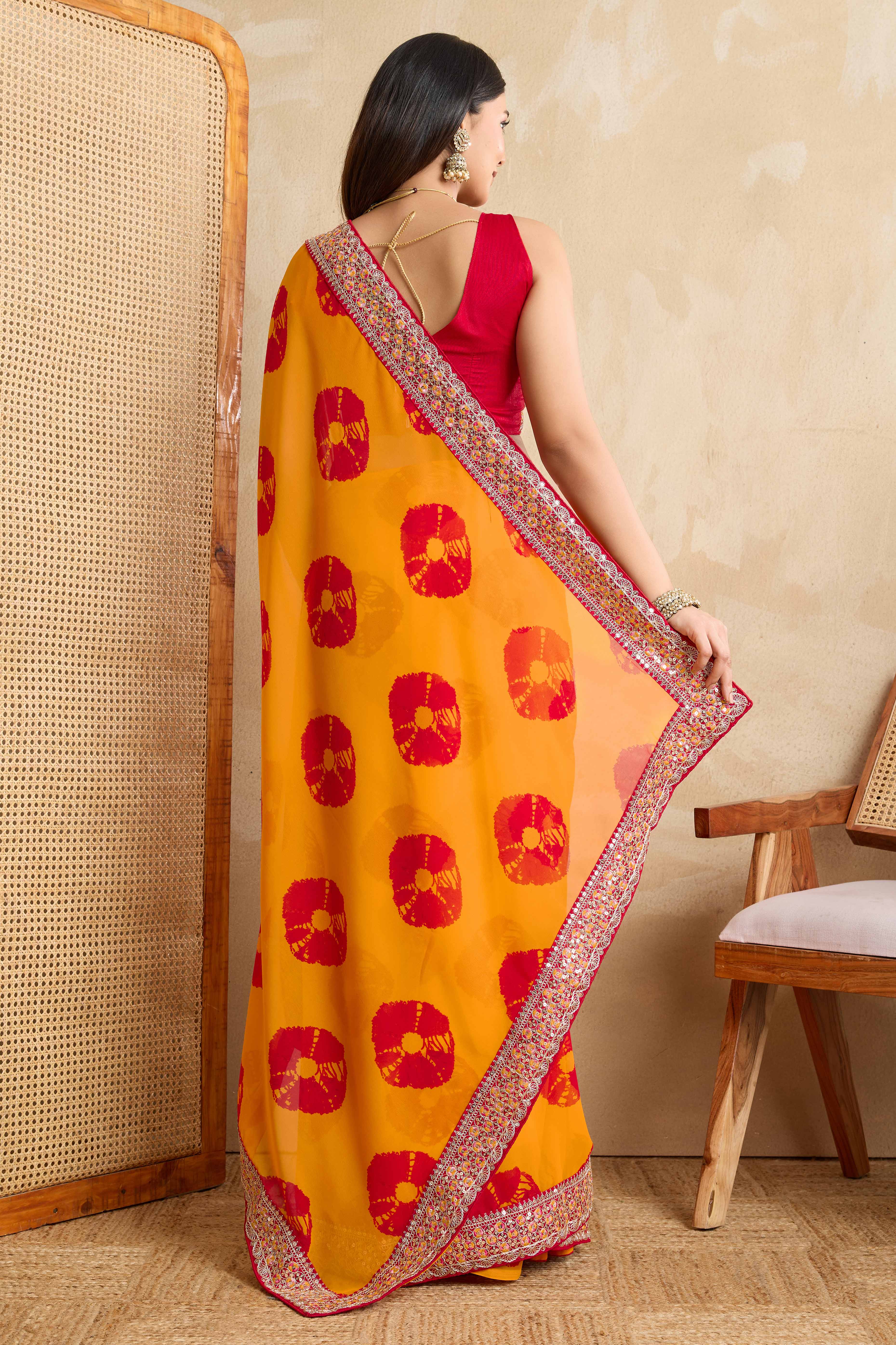 Bright Orange Georgette Saree with Contemporary Tie-Dye Patterns and Classic Lace Work Finish