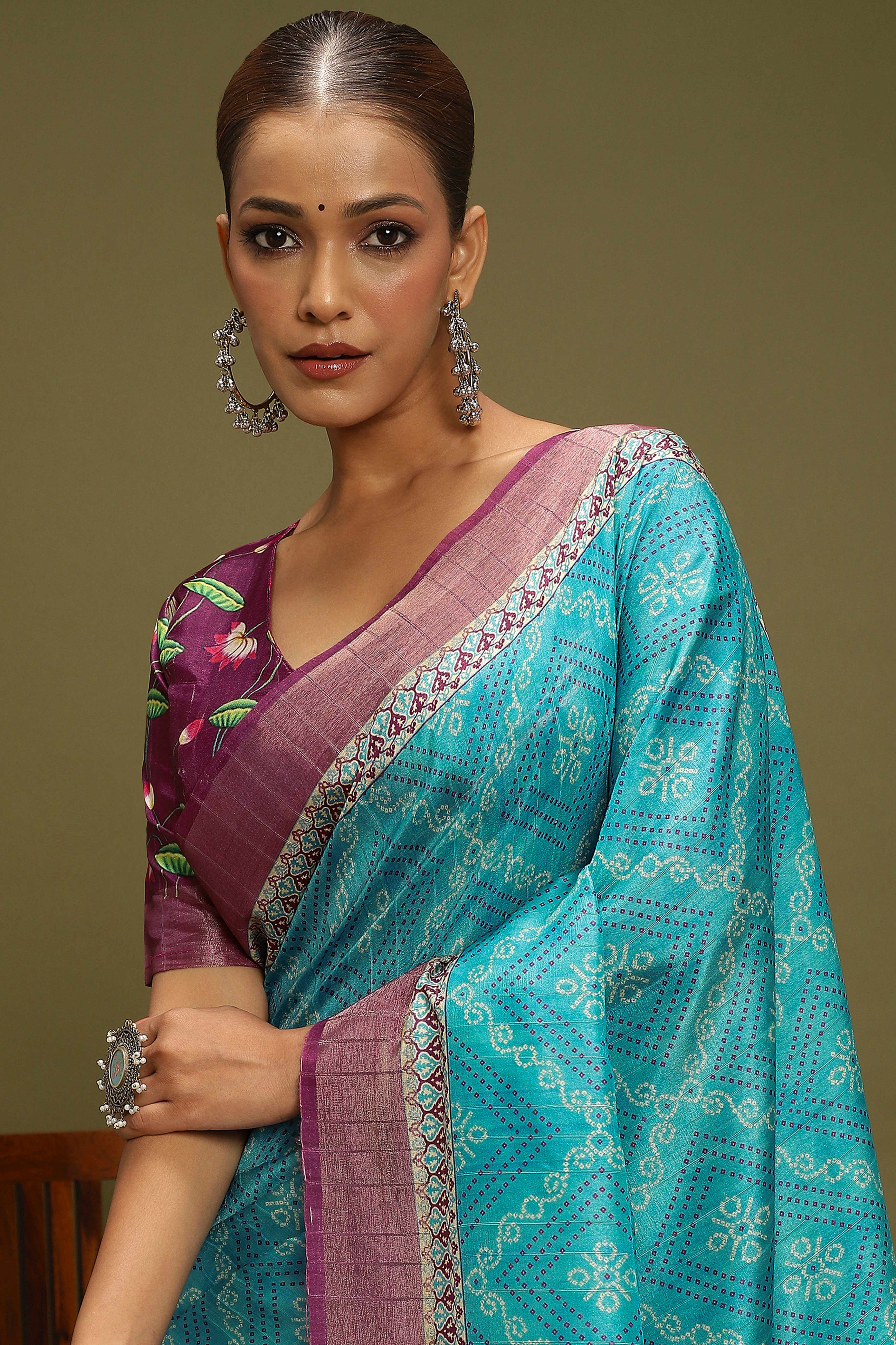 Turquoise Silk Blend Saree Decorated with Vibrant Bandhani Prints and Festive Detailing