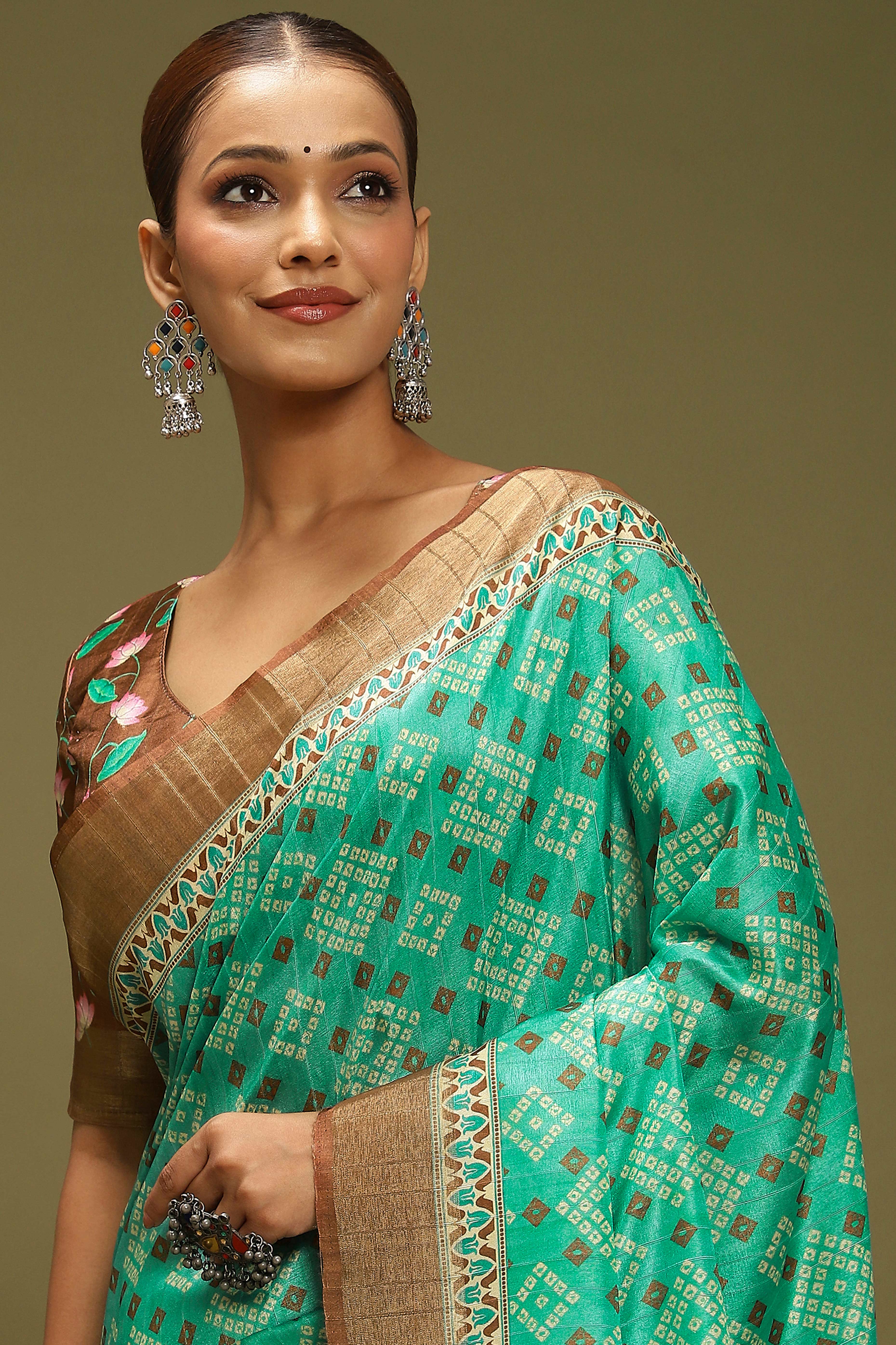 Rama Green Silk Blend Saree Decorated with Vibrant Bandhani Prints and Festive Detailing