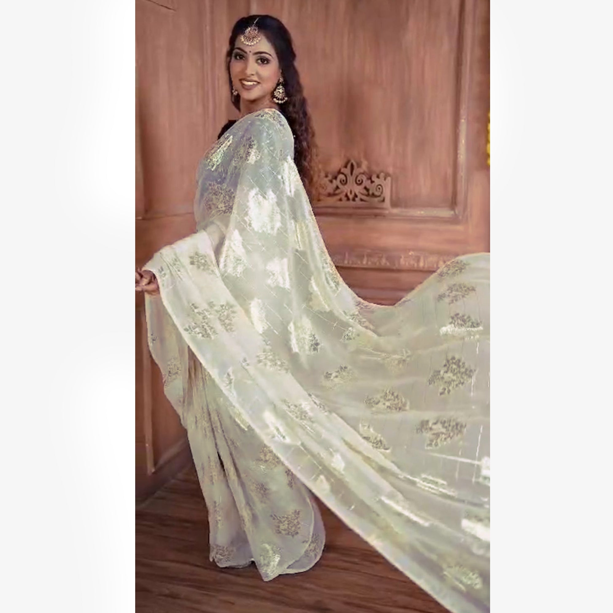 White Floral Woven Georgette Saree With Tassels