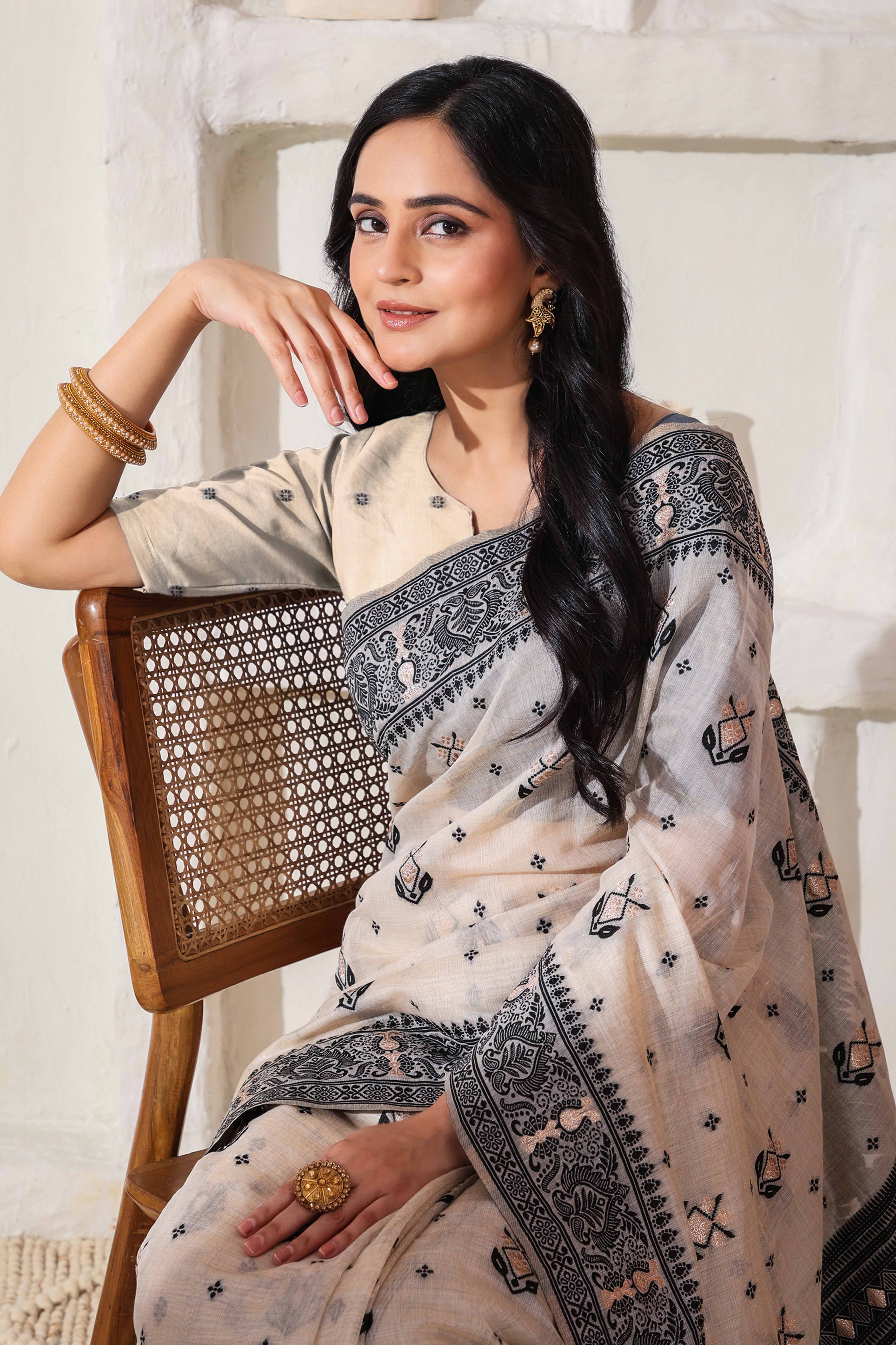 Classic Cream & Black Linen Cotton Saree Featuring Intricate Zari Weaving & Tassel Pallu