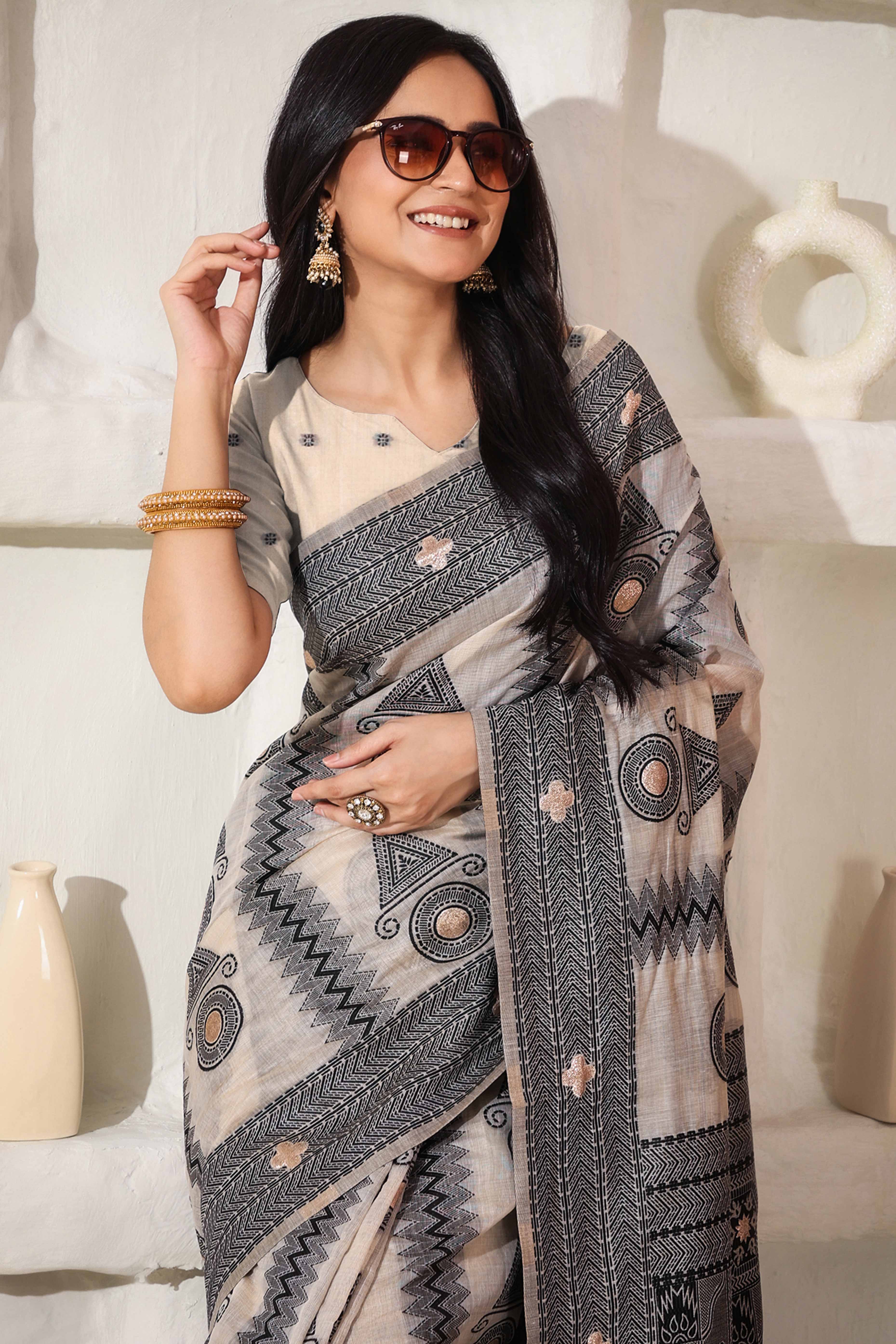 Elegant Zari Weaving Work On Cream & Black Linen Cotton Saree With Tassel Finish