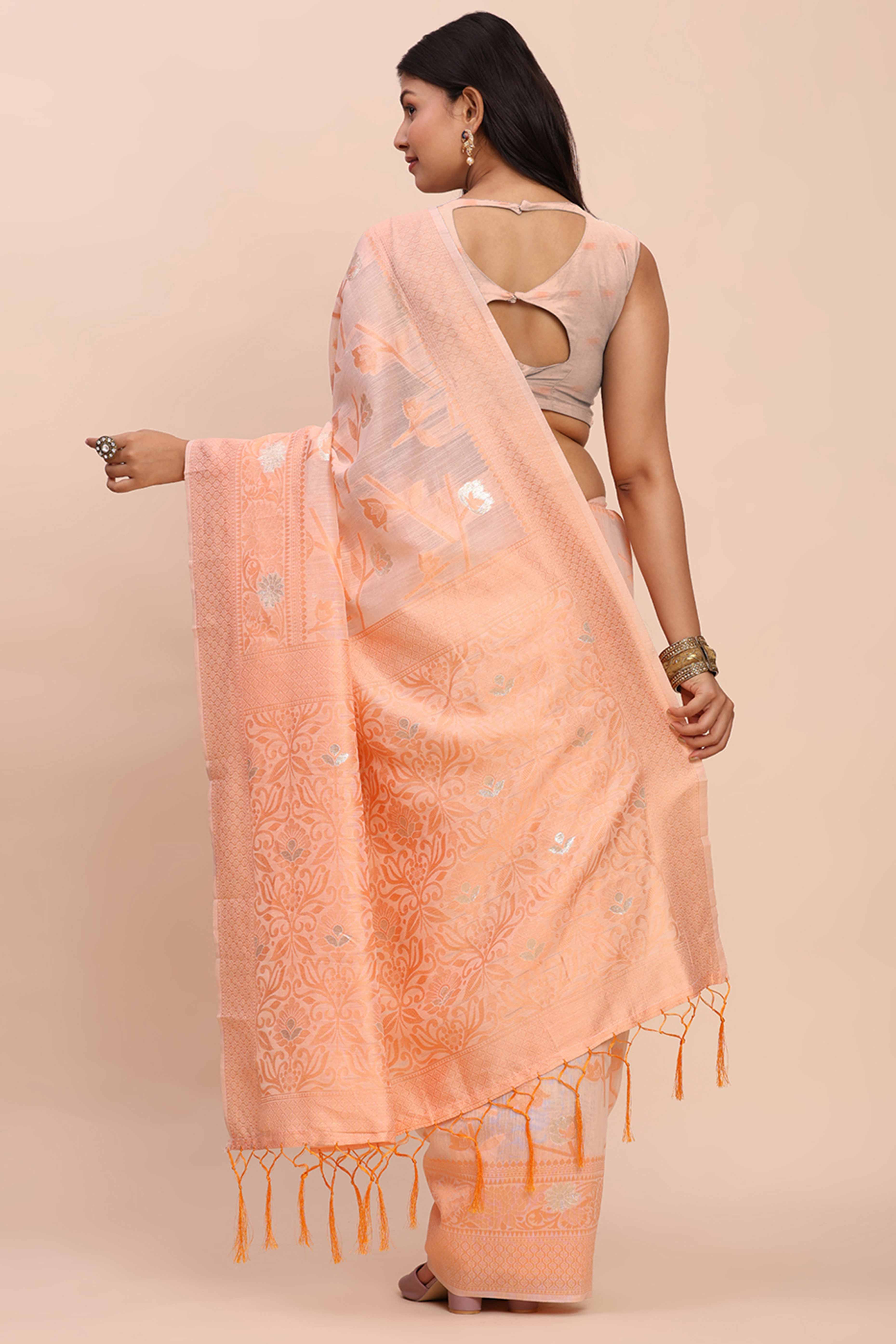 Peach Floral Linen Cotton Saree Accented With Zari Weaving & Tassel Pallu Elegance