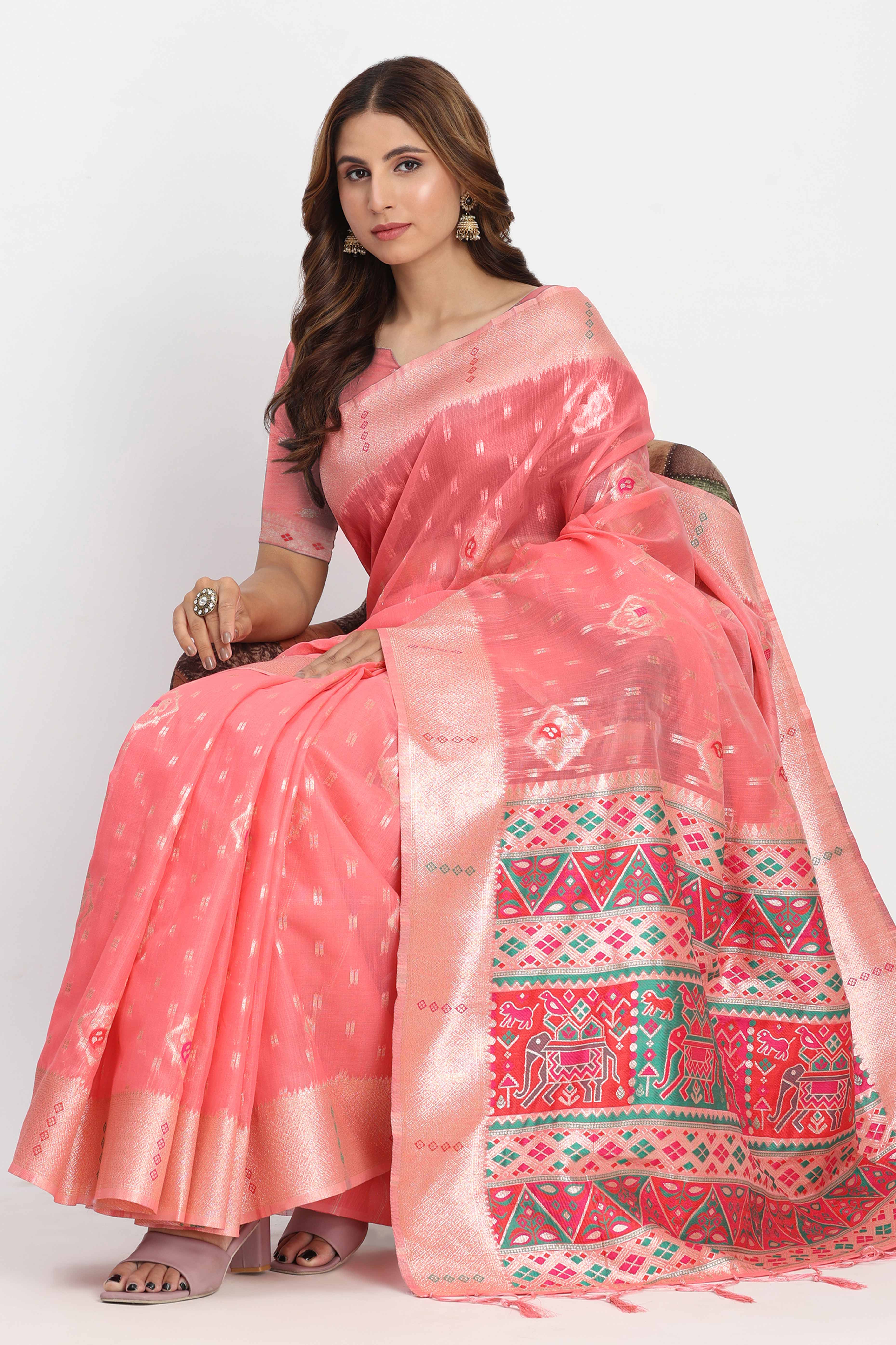 Shimmering Coral Pink linen Cotton Saree Embellished With Rich Zari Weaving And Tassels Pallu