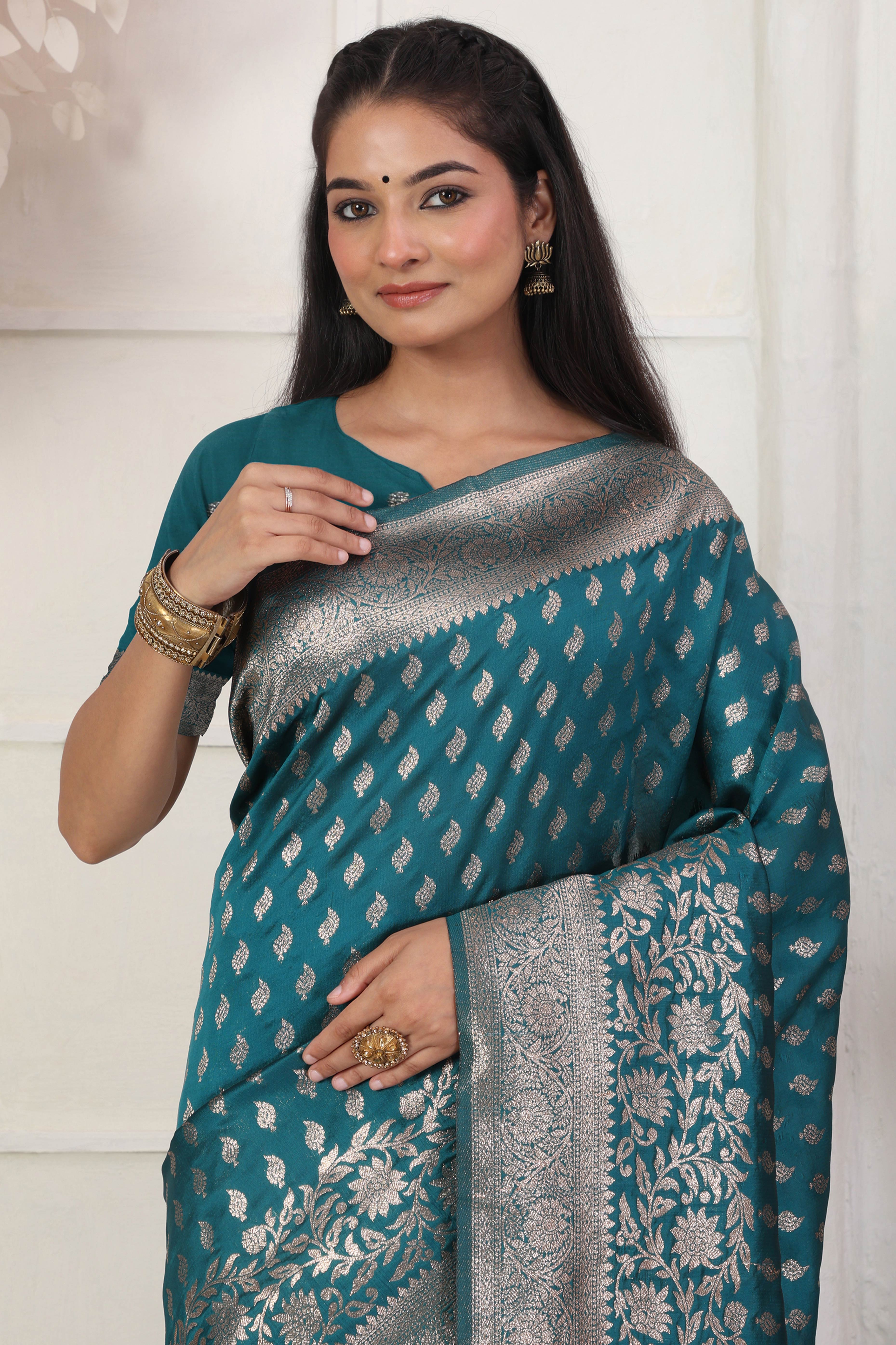 Rama Blue Traditional Lichi Silk Blend Saree Enhanced With Floral Zari Weaving & Tassel Pallu