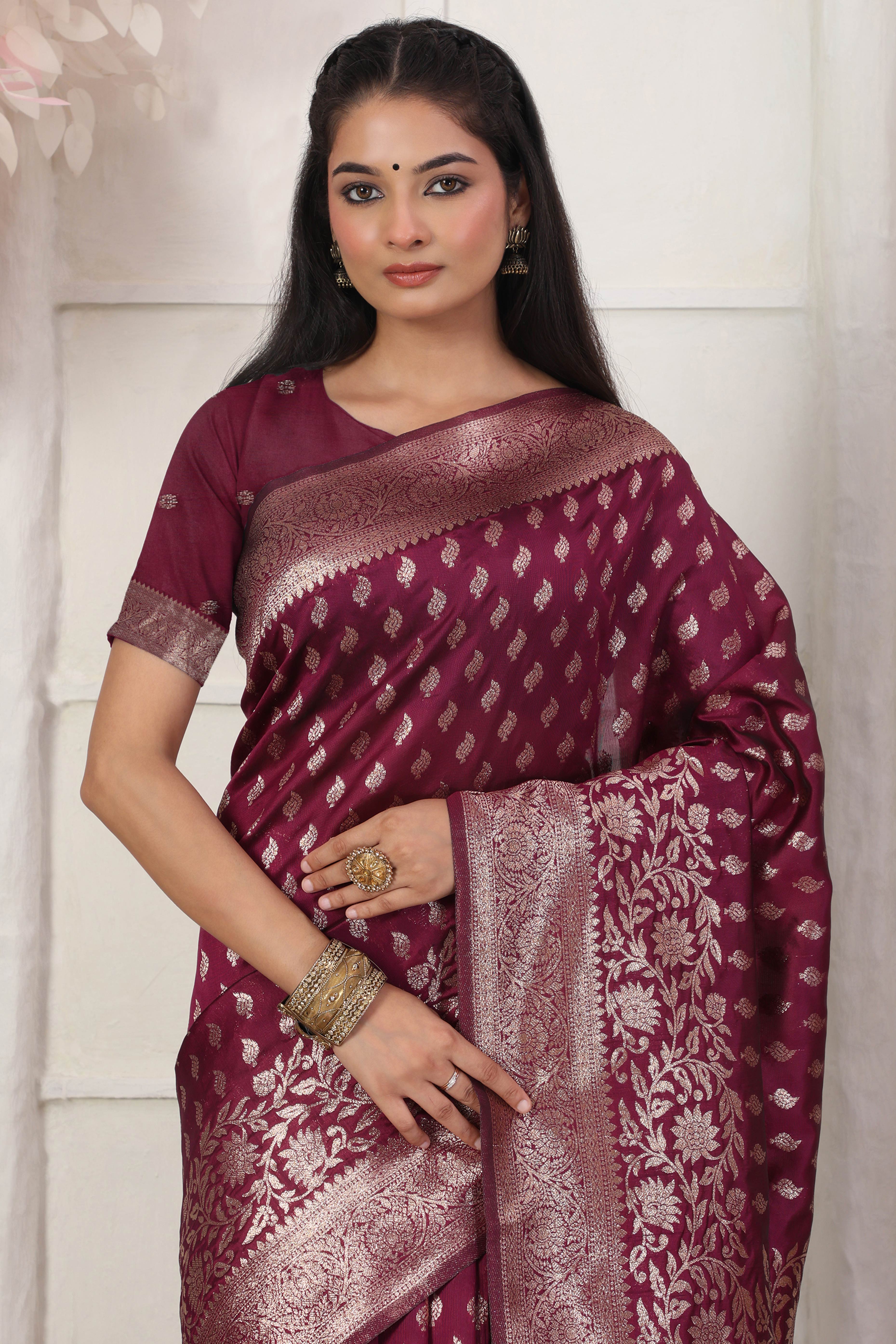 Wine Traditional Lichi Silk Blend Saree Enhanced With Floral Zari Weaving & Tassel Pallu