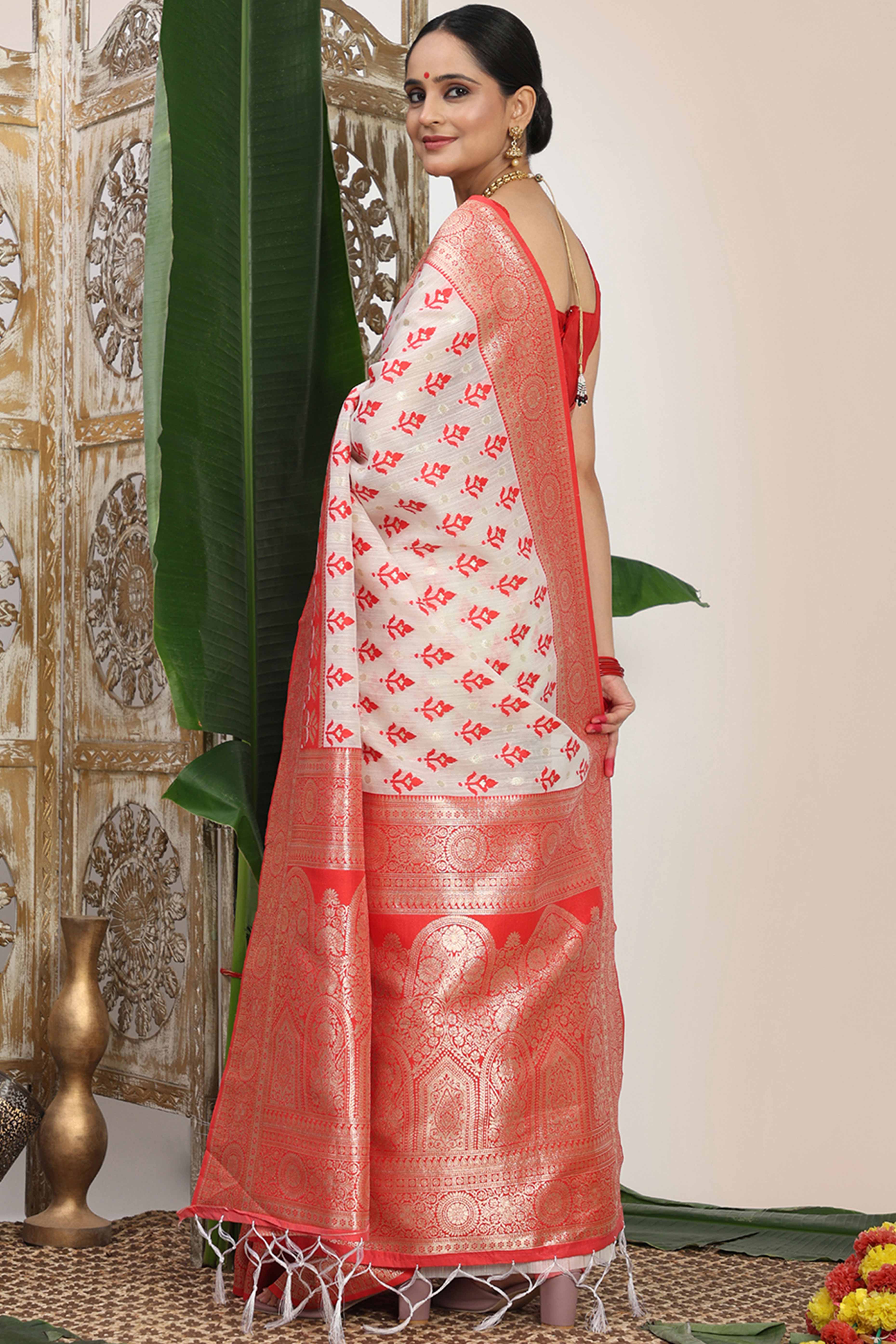 White & Red Linen Cotton Saree Showcasing Elegant Zari Weaving And A Tassel-Embellished Pallu