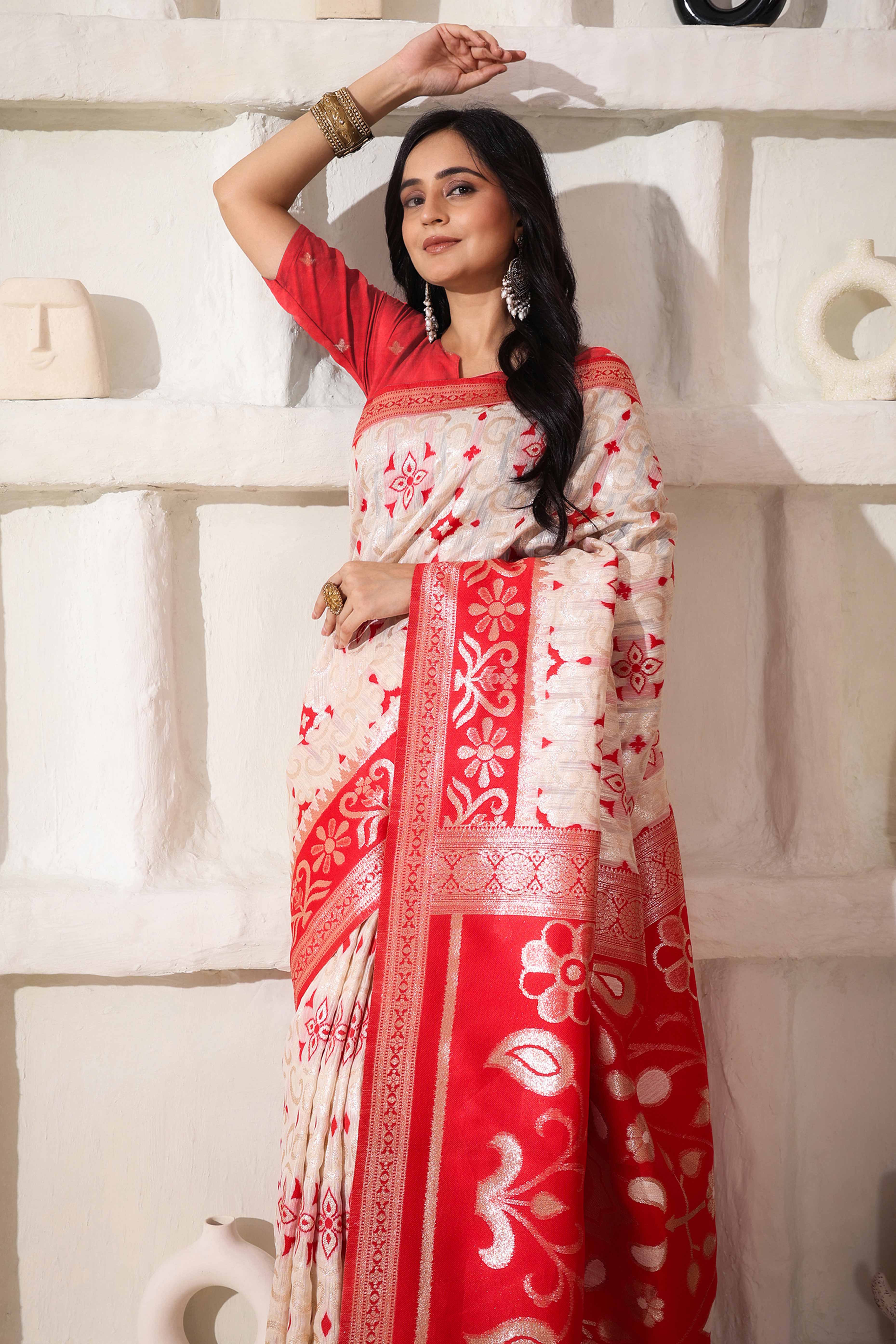 White & Red Linen Cotton Saree Adorned With Intricate Zari Weaving And Tassel Pallu