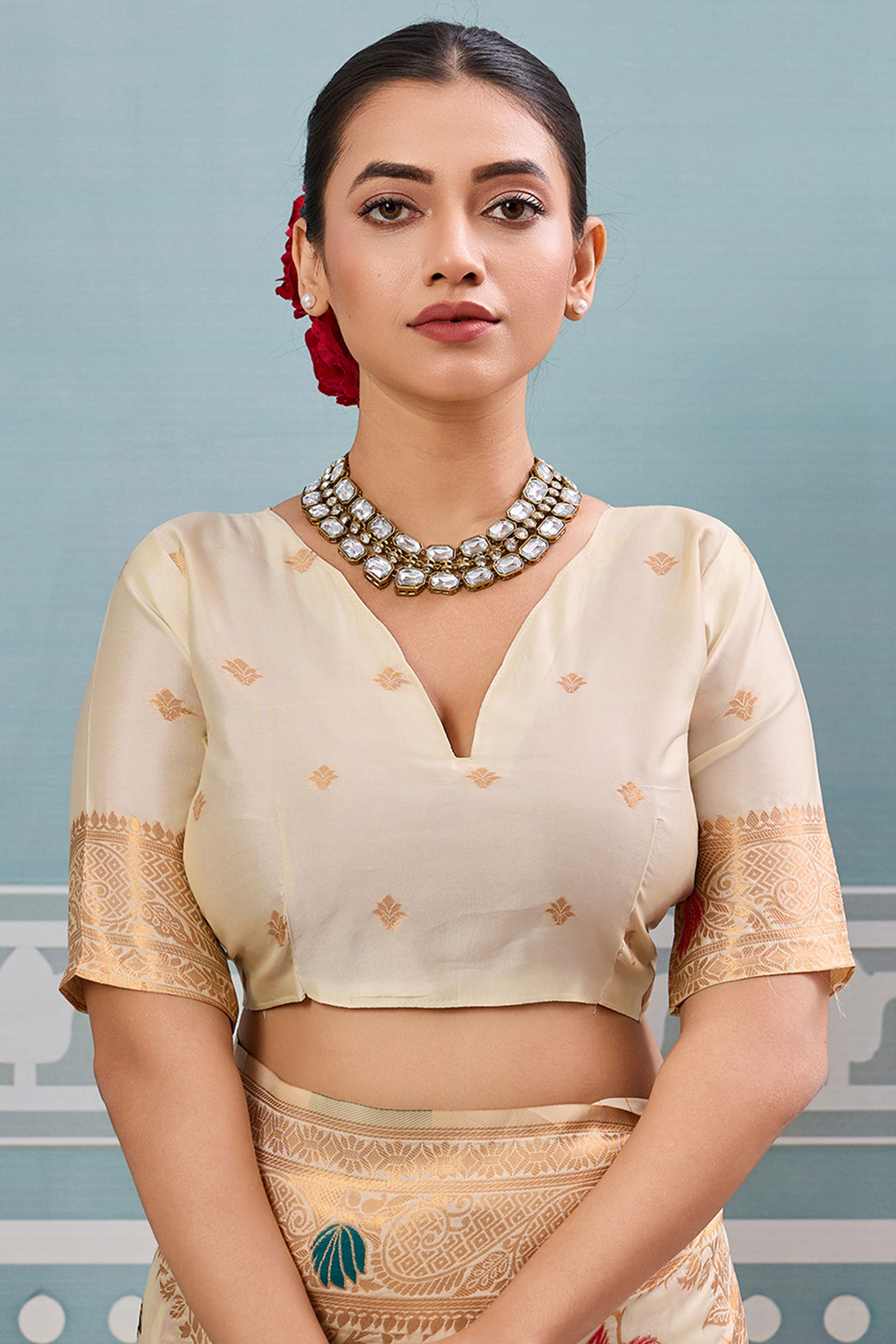 Radiant Cream Silk Blend Saree Adorned With Intricate Floral Zari Weaving & Tassel Pallu