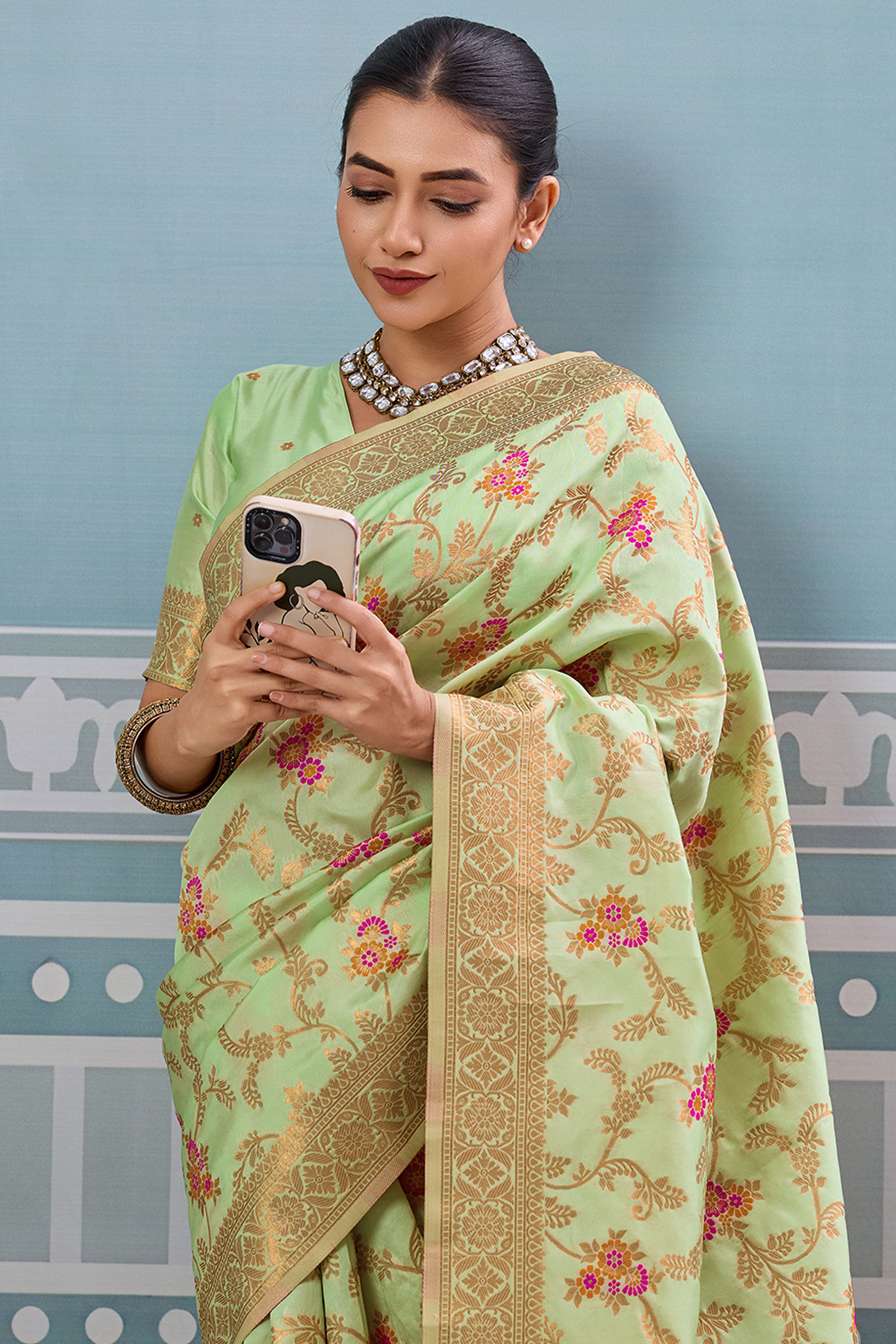 Majestic Bloom Pista Green Floral Zari Weaving Silk Blend Saree With Elegant Tassel Pallu