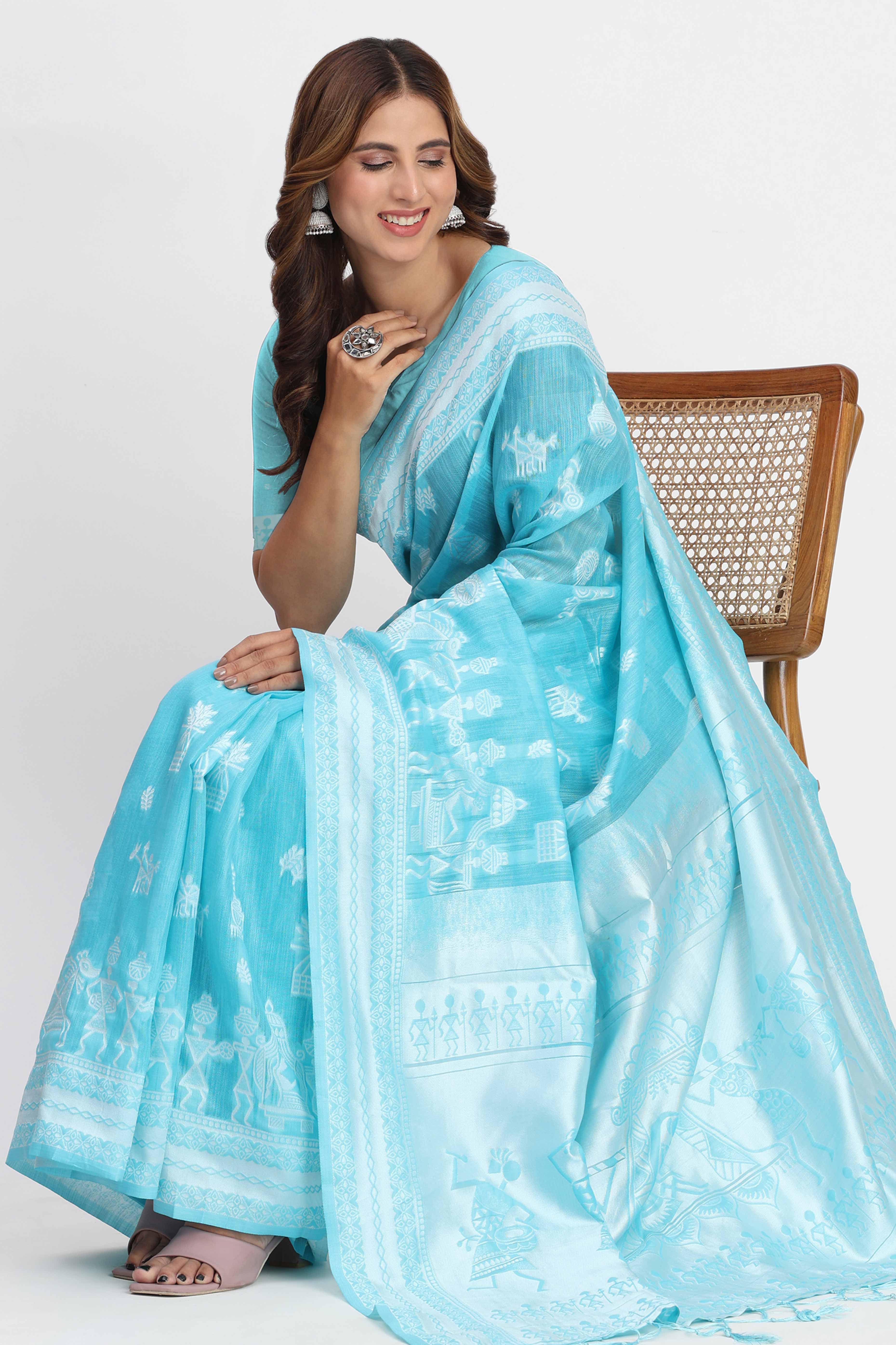 Blue Linen Cotton Saree Showcasing Traditional Warli Motifs In Zari Weaving With Tassel Pallu