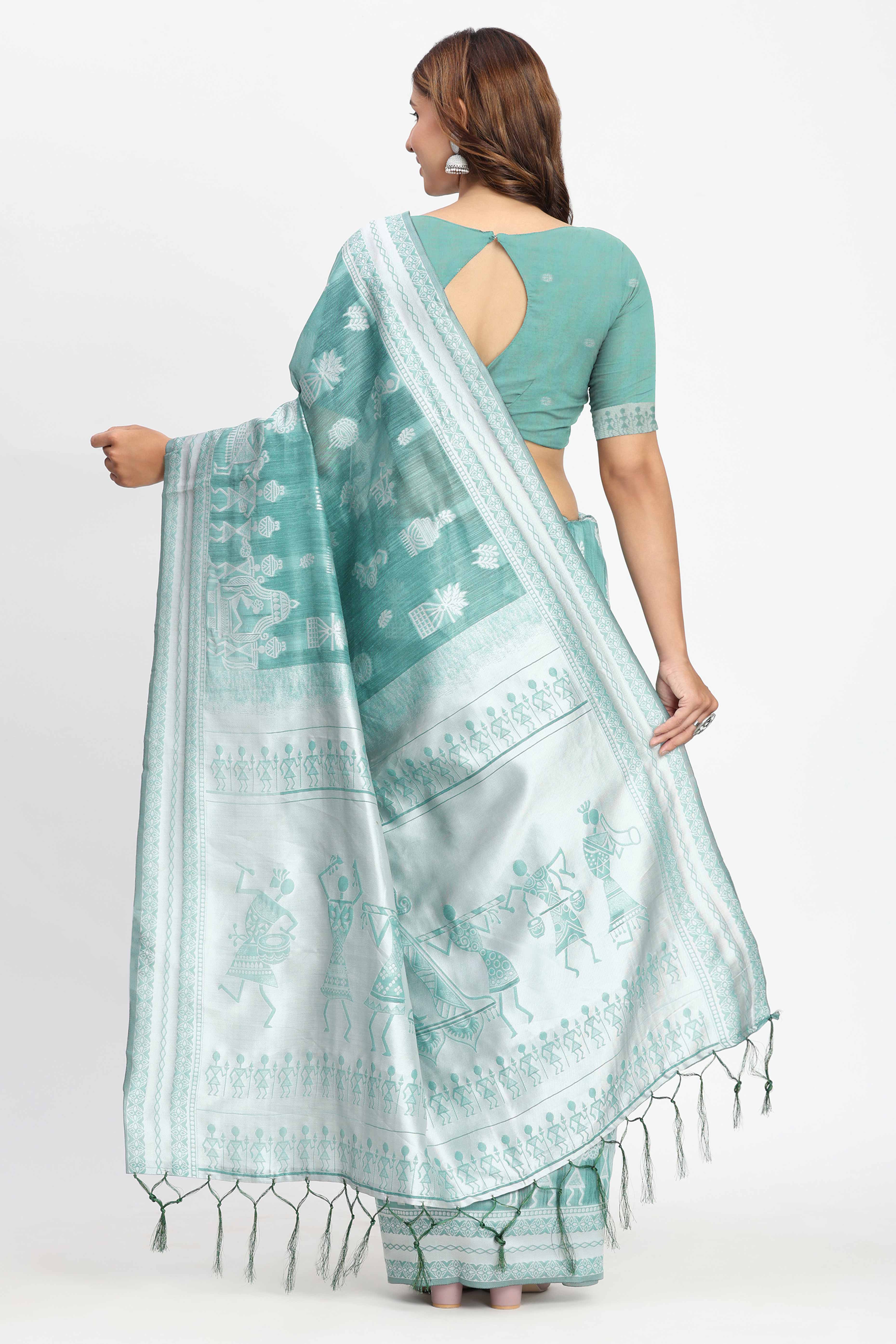Pastel Sea Green Linen Cotton Saree Showcasing Warli Motifs In Zari Weaving With Tassel Pallu
