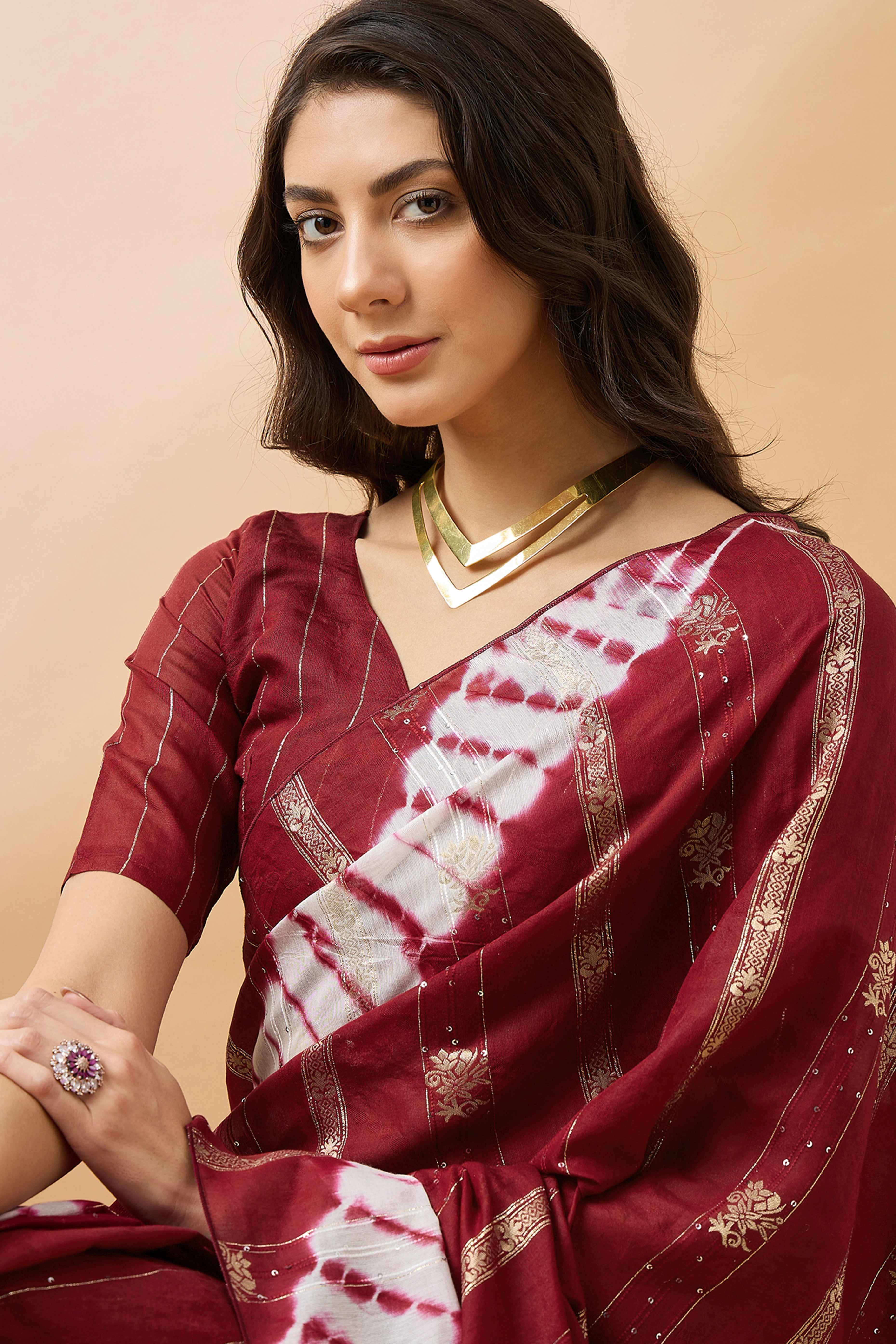 Maroon Floral Woven Staple Cotton Blend Saree Highlighted With Sequins Embroidery & Tasselled Pallu