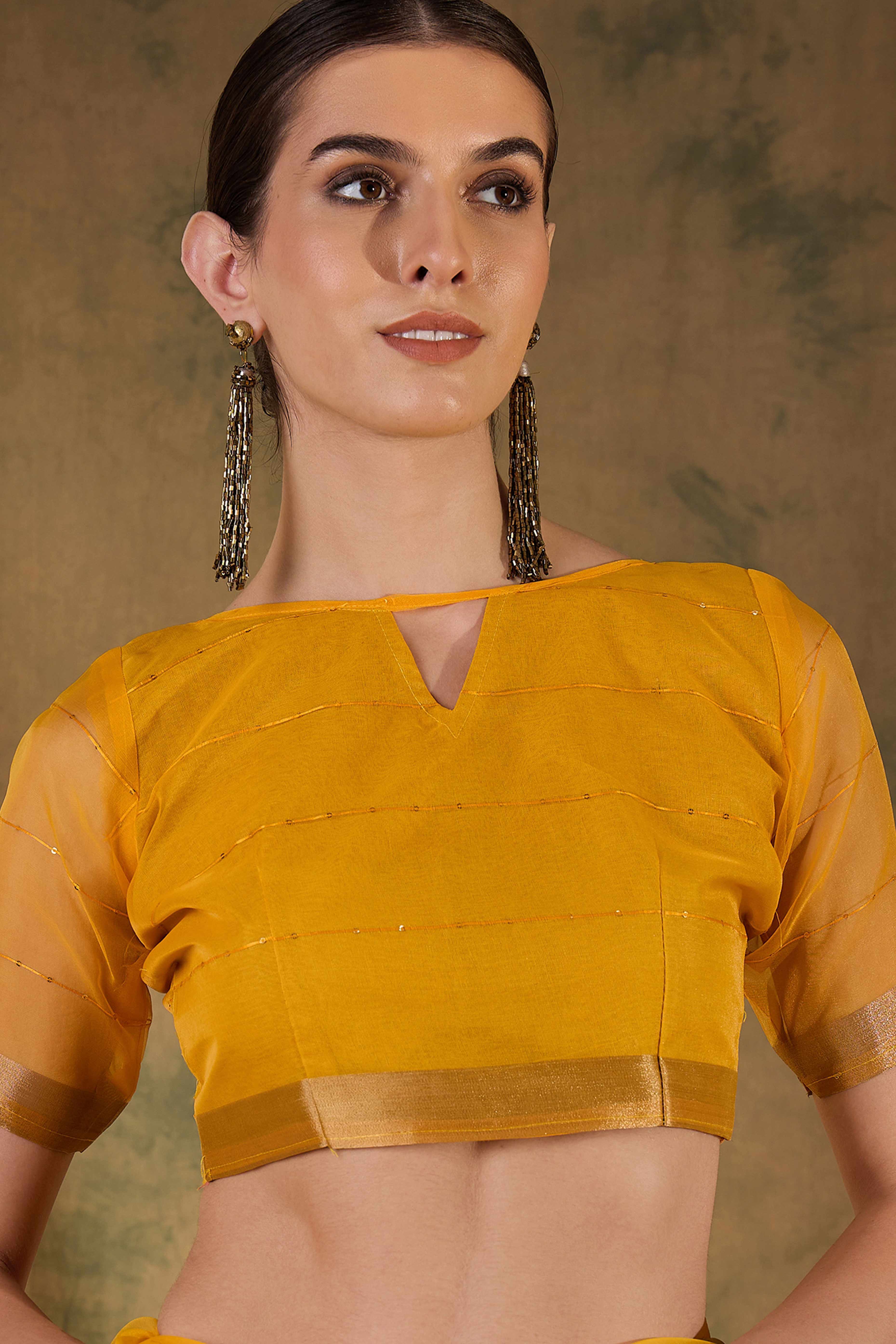 Yellow Organza Silk Saree Featuring Shimmering Sequins Embroidery & Elegant Tasselled Pallu