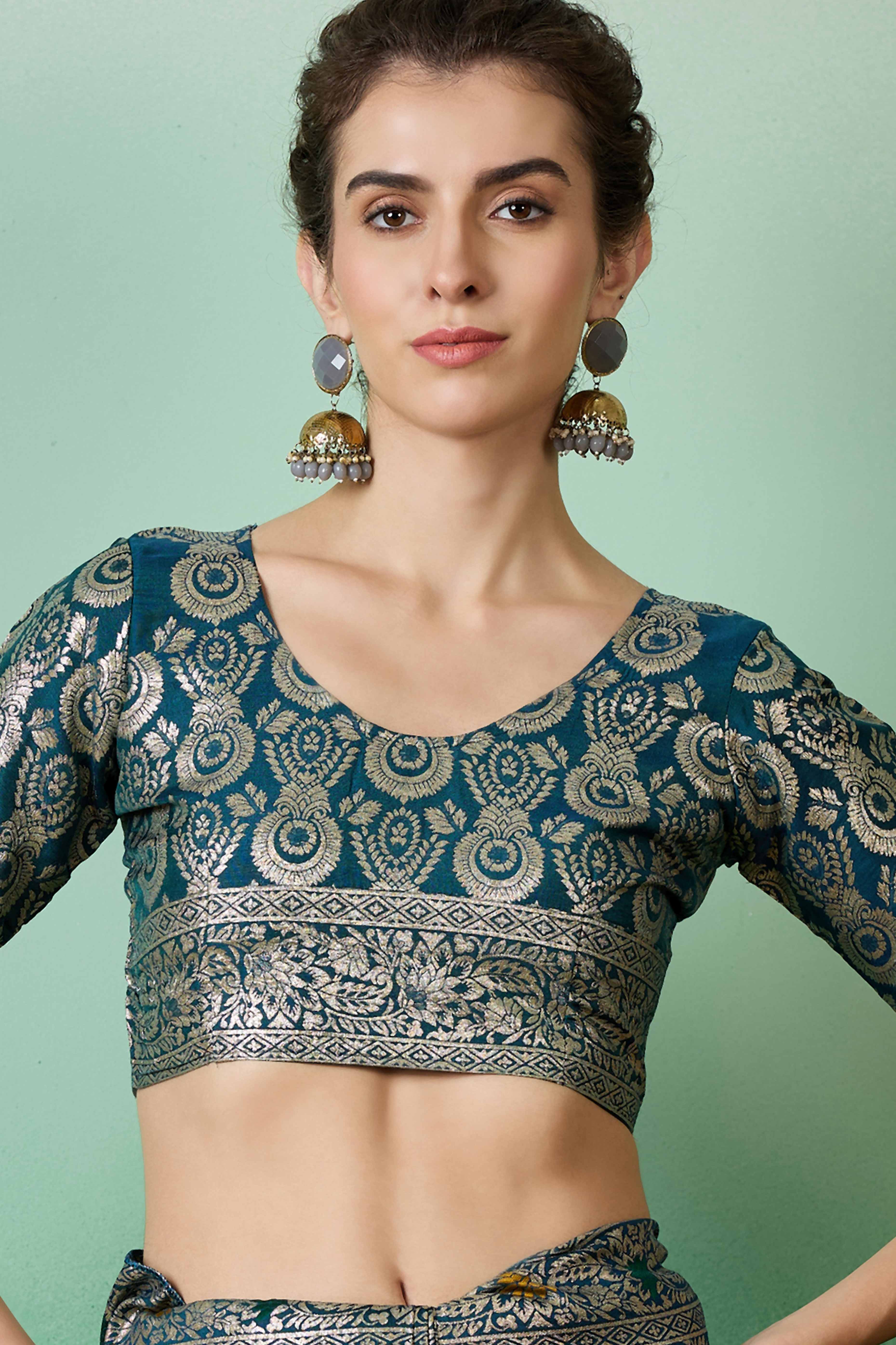 Teal Cotton Meena jacquard Saree Featuring Intricate Floral Weaving & Tassels On The Pallu