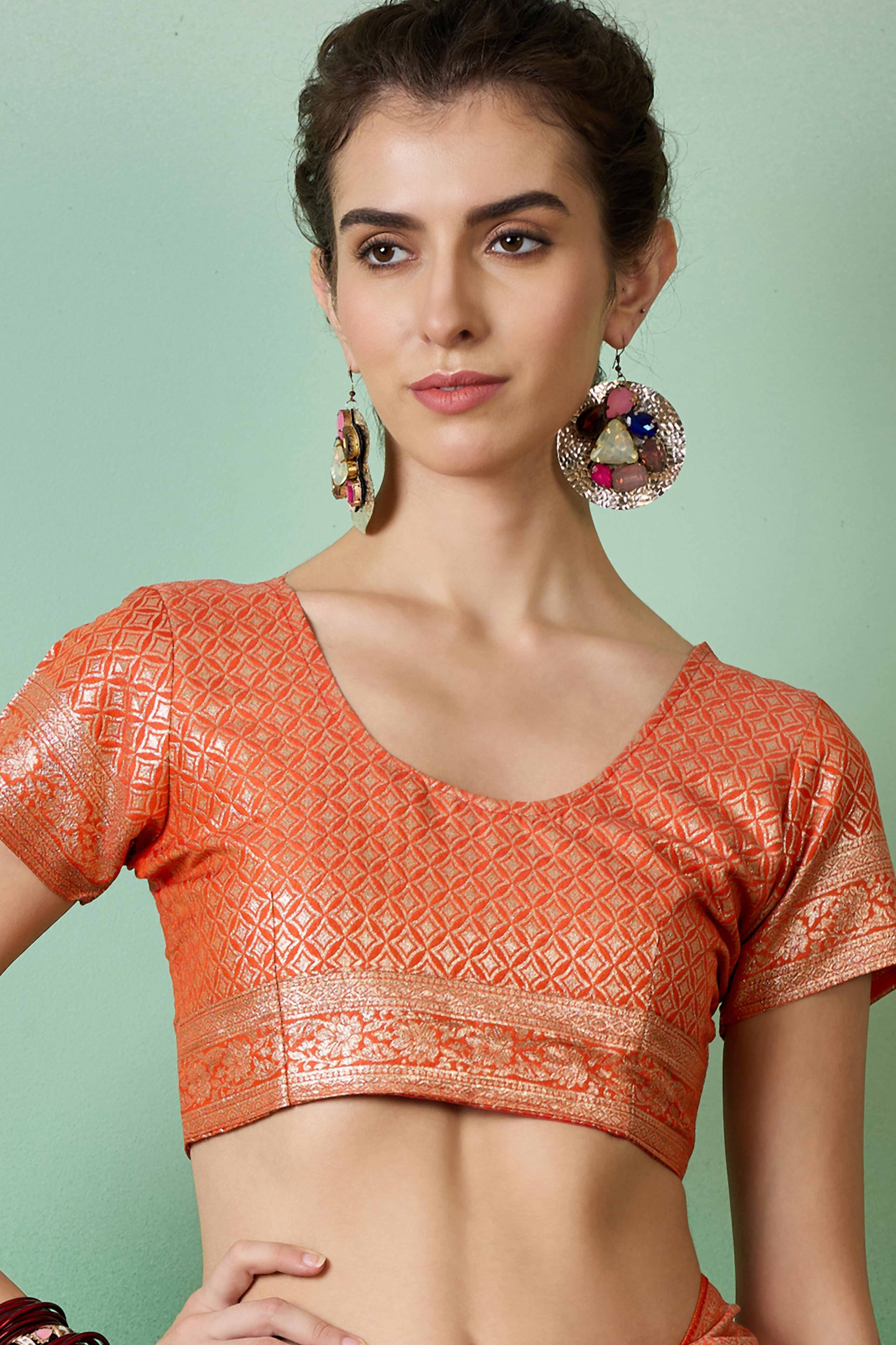 Orange Cotton Blend Saree Adorned With Floral Zari Weaving & Soft Tassel Accents