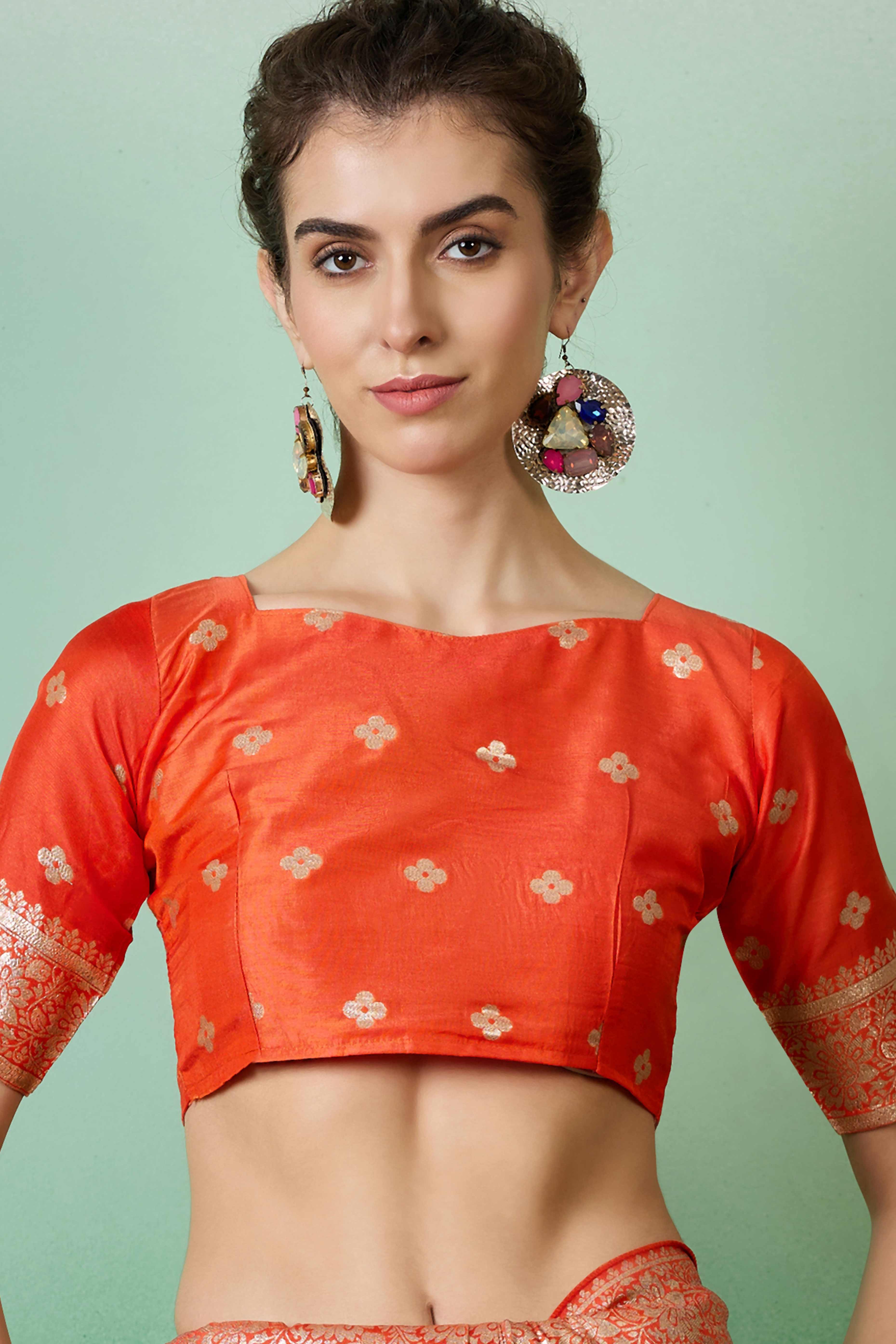 Orange Cotton Blend Jacquard Saree Adorned With Floral Weaving & Graceful Tassel Pallu