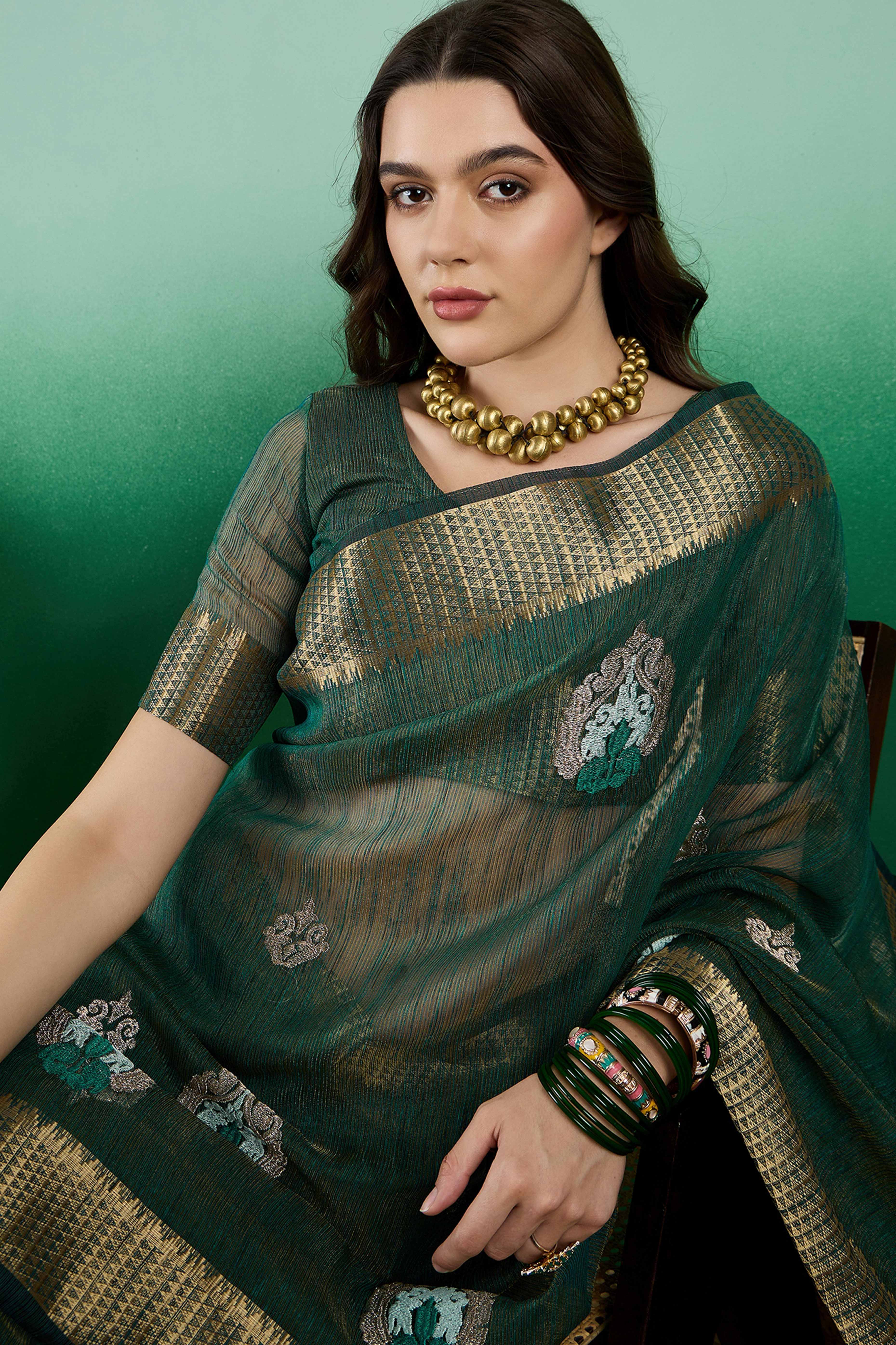Green Khadi Organza Saree Adorned With Elegant Embroidery & Tassel Pallu