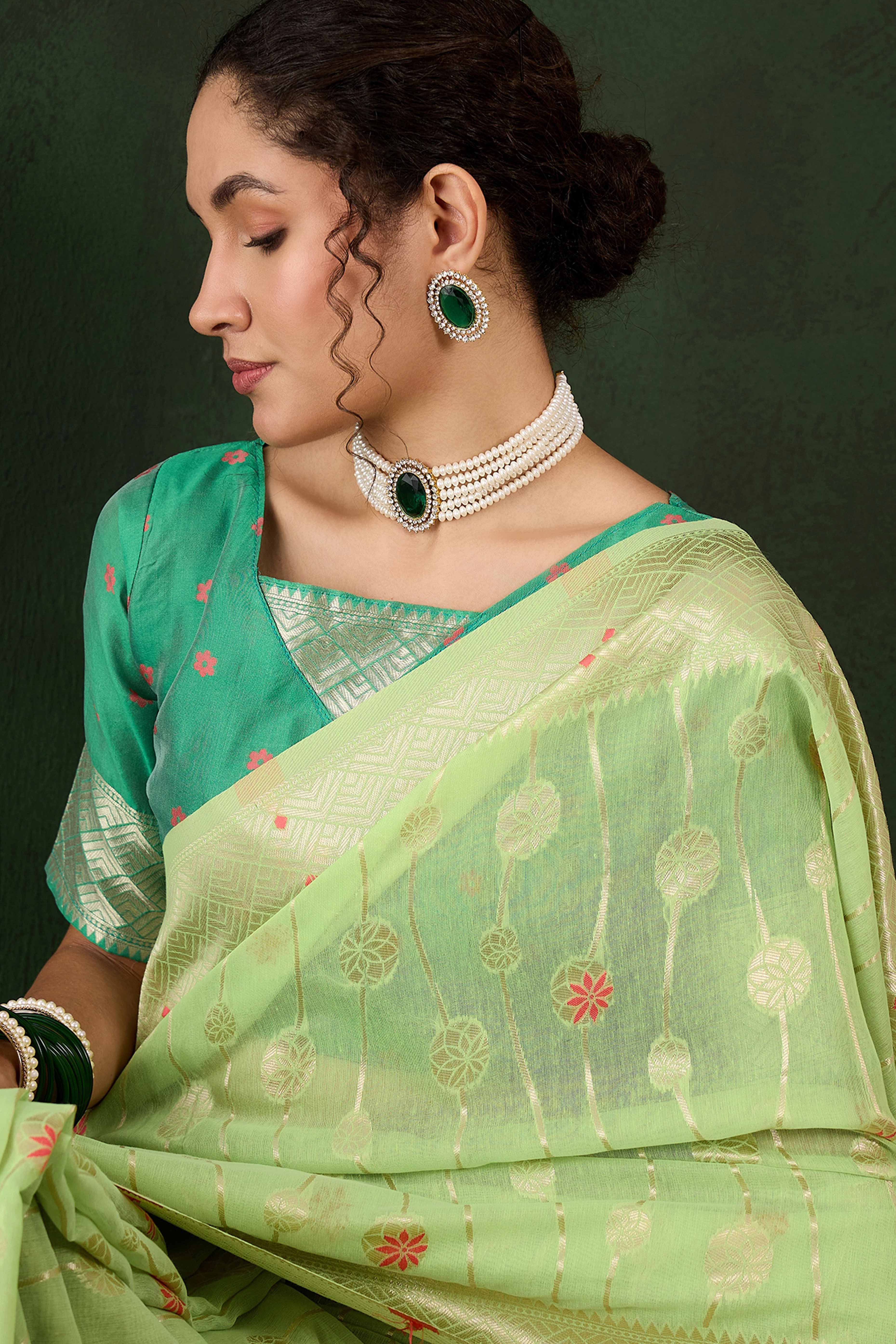 Green Cotton Blend Saree Adorned With Intricate Floral Zari Weaving & A Stylish Tassel Pallu