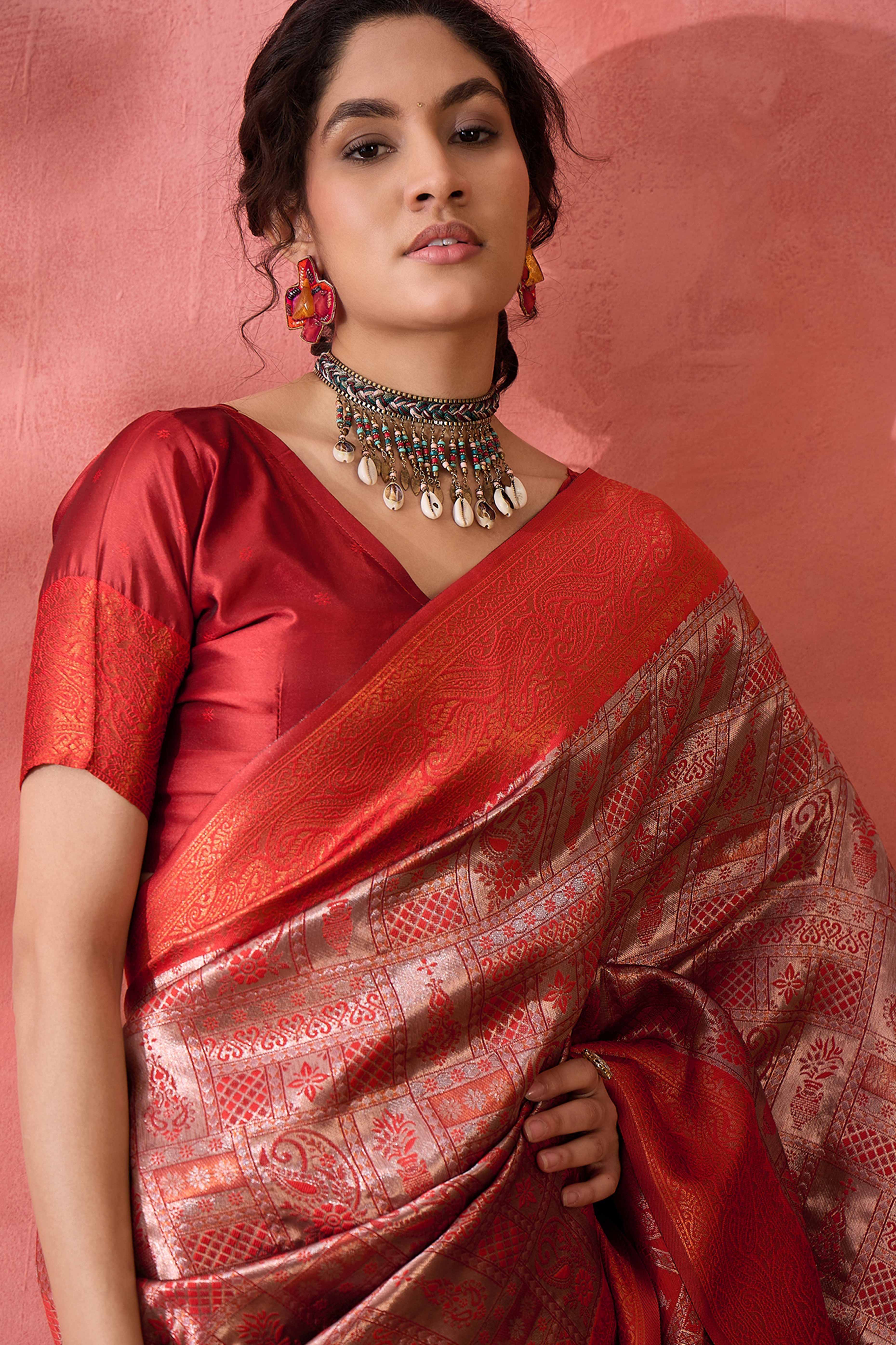 Rust Woven Poly Silk Blend Saree Featuring Floral & Paisley Motifs With Tassel Accents