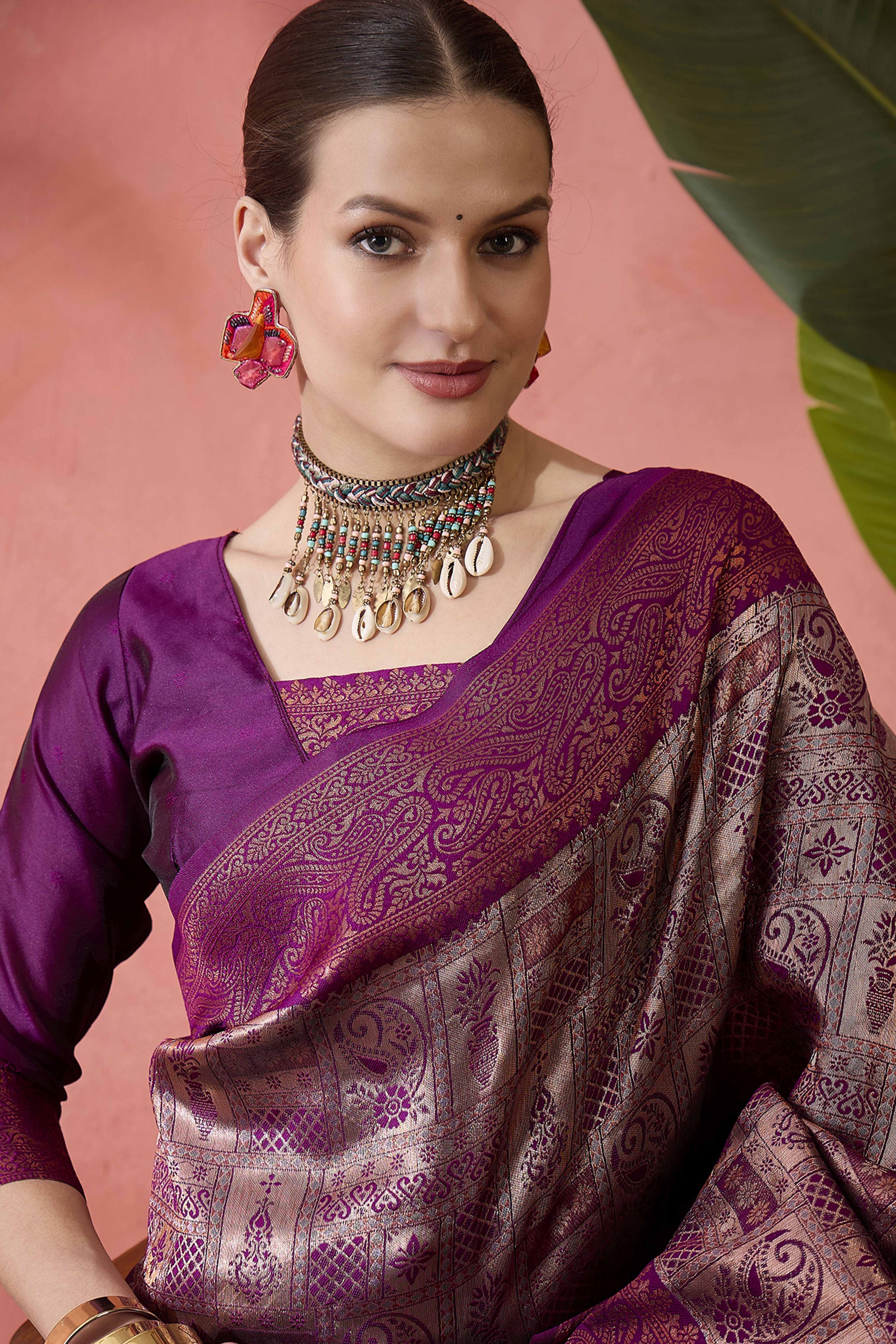 Wine Woven Poly Silk Blend Saree Featuring Floral & Paisley Motifs With Tassel Accents