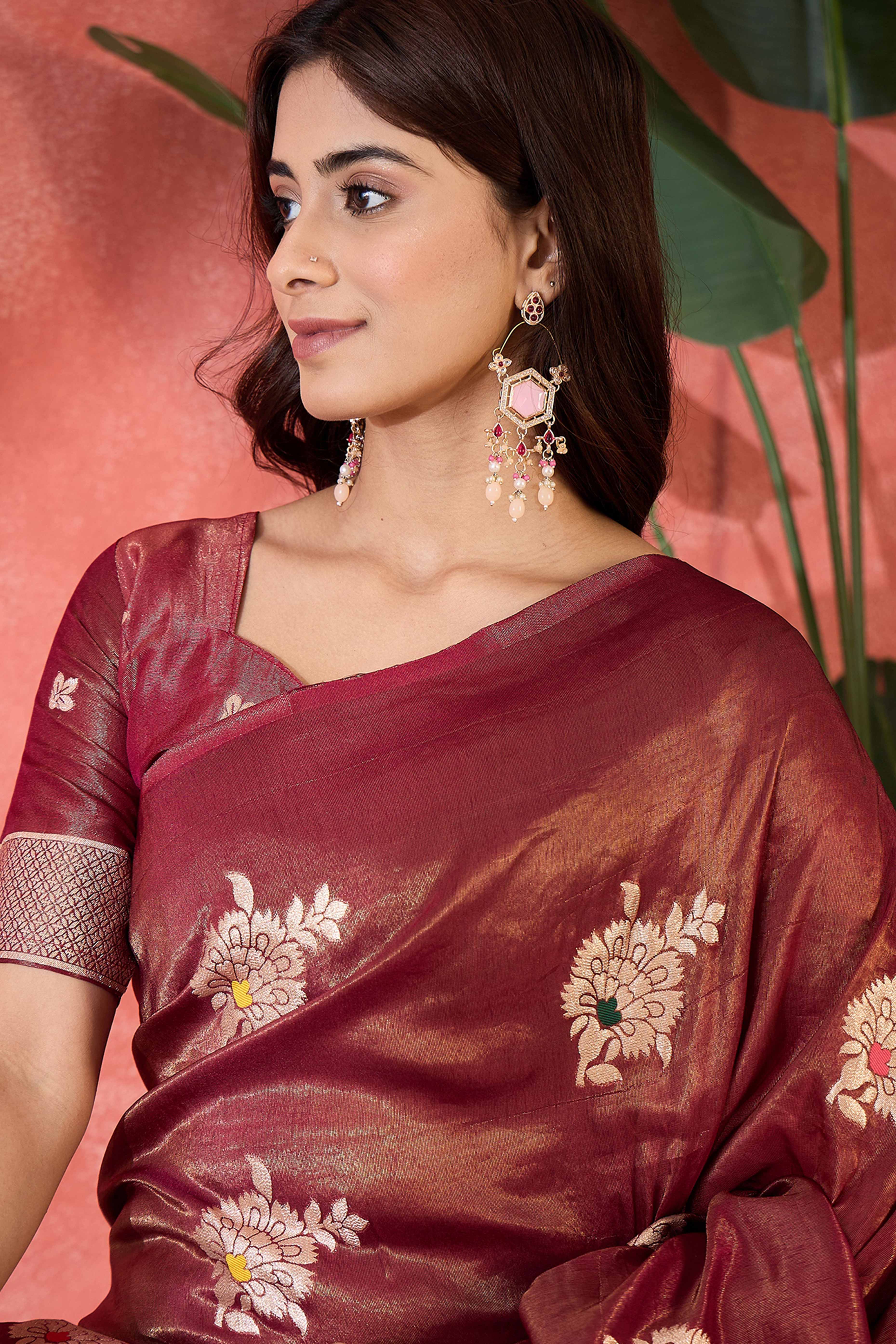 Wine Shimmer Saree Featuring Intricate Floral Zari Weaving & Tassel Finish