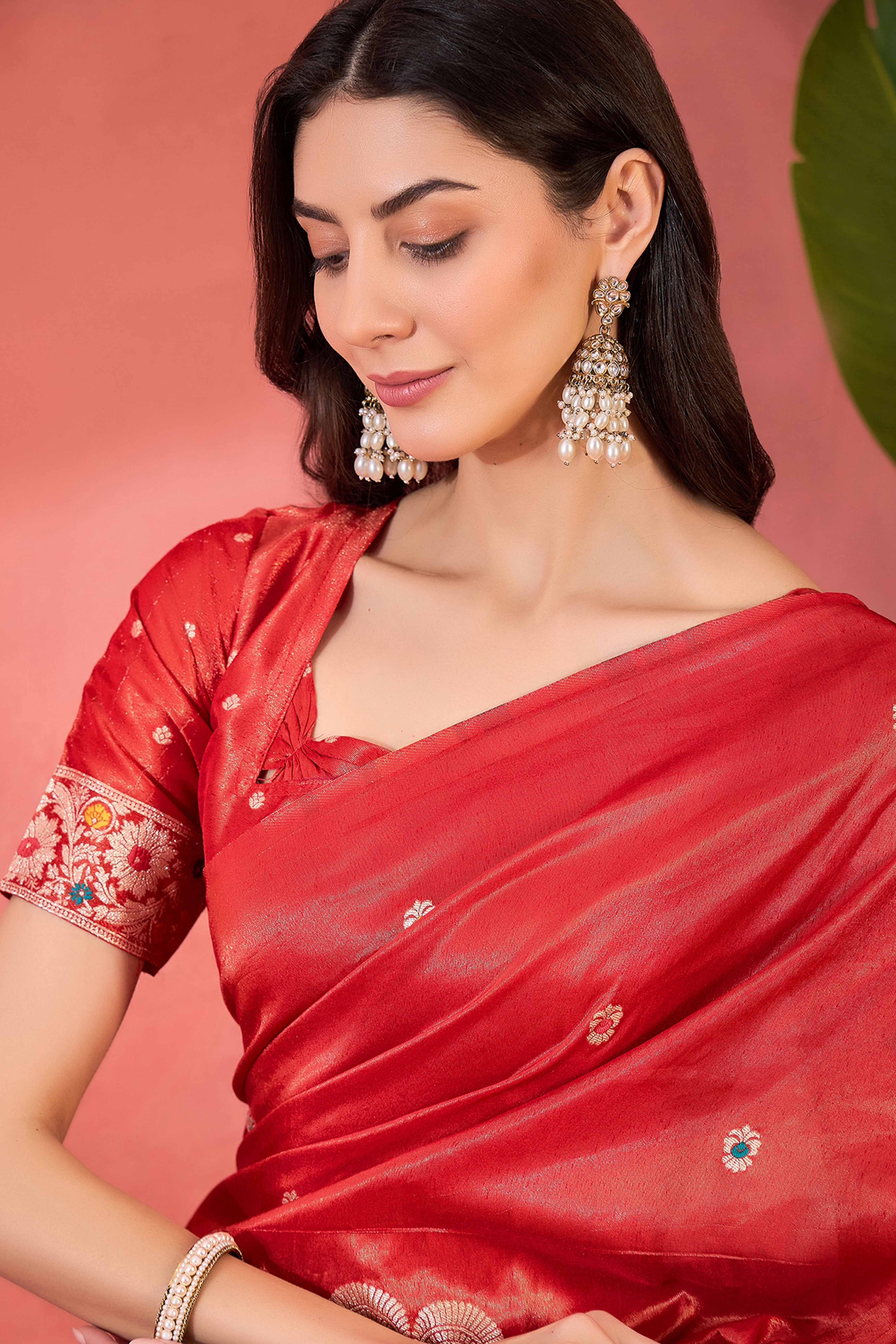 Red Zari Woven Shimmer Saree With Floral Motifs & Flowing Tassel Pallu