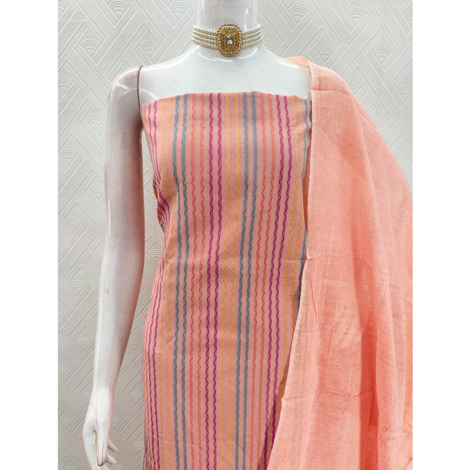 Peach Poly Cotton Blend Dress Material Highlighted With Striped Woven Work