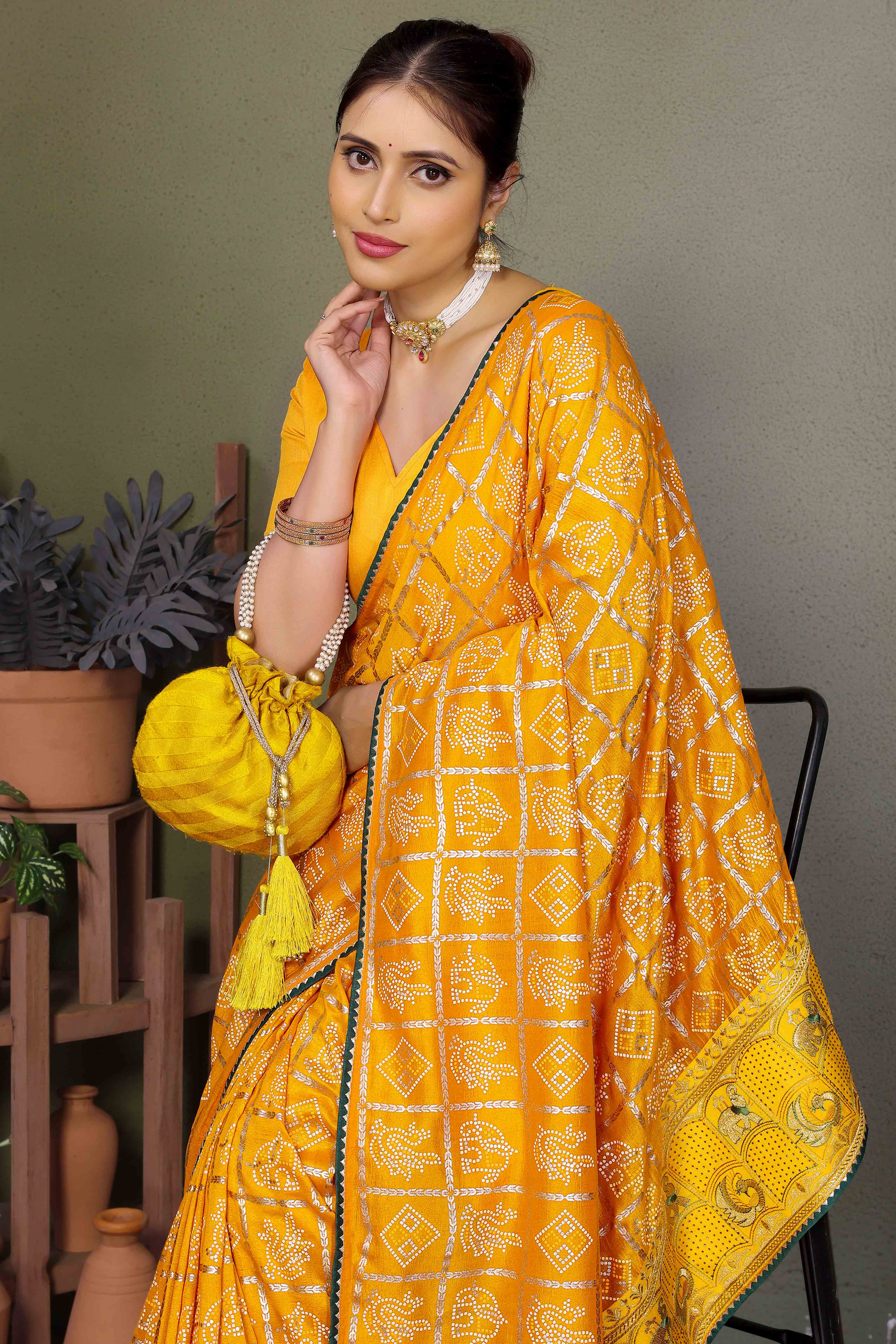 Yellow Vichitra Silk Saree Featuring Bandhani Patterns and Graceful Embroidered Borders