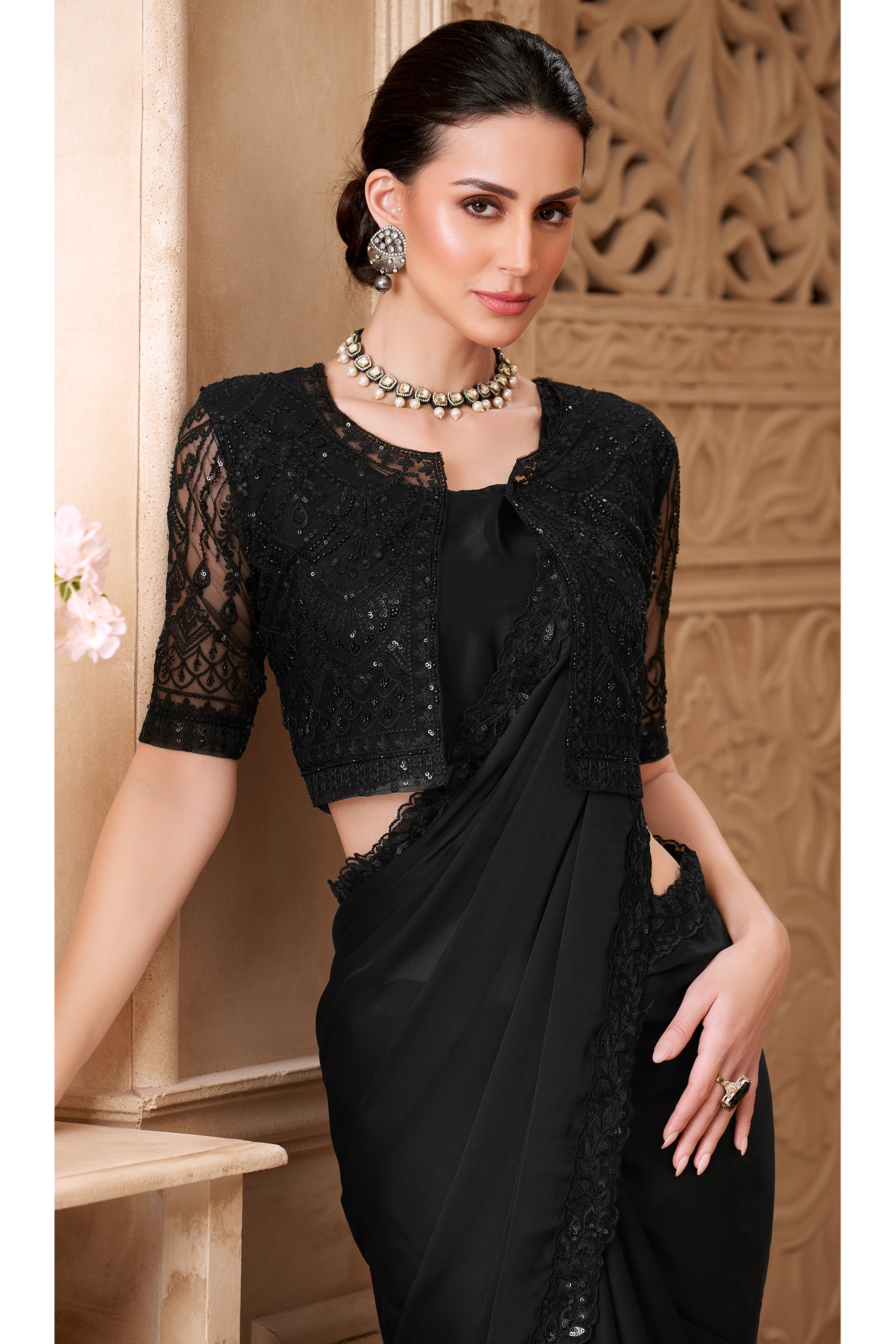 Shimmering Black Georgette Saree with Graceful Thread Embellishment and Sequins