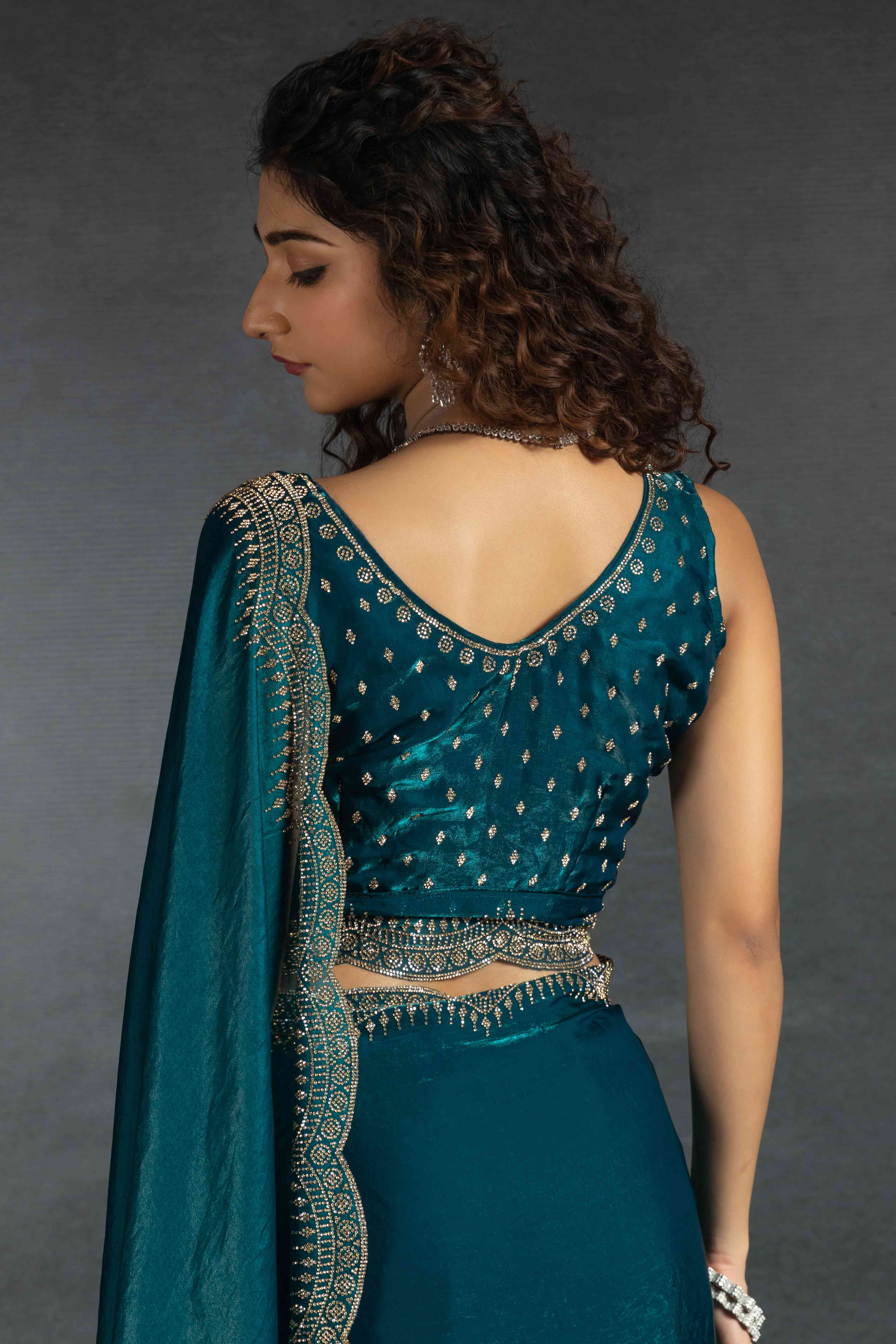 Teal Satin Saree Embellished with Stones for a Party Look