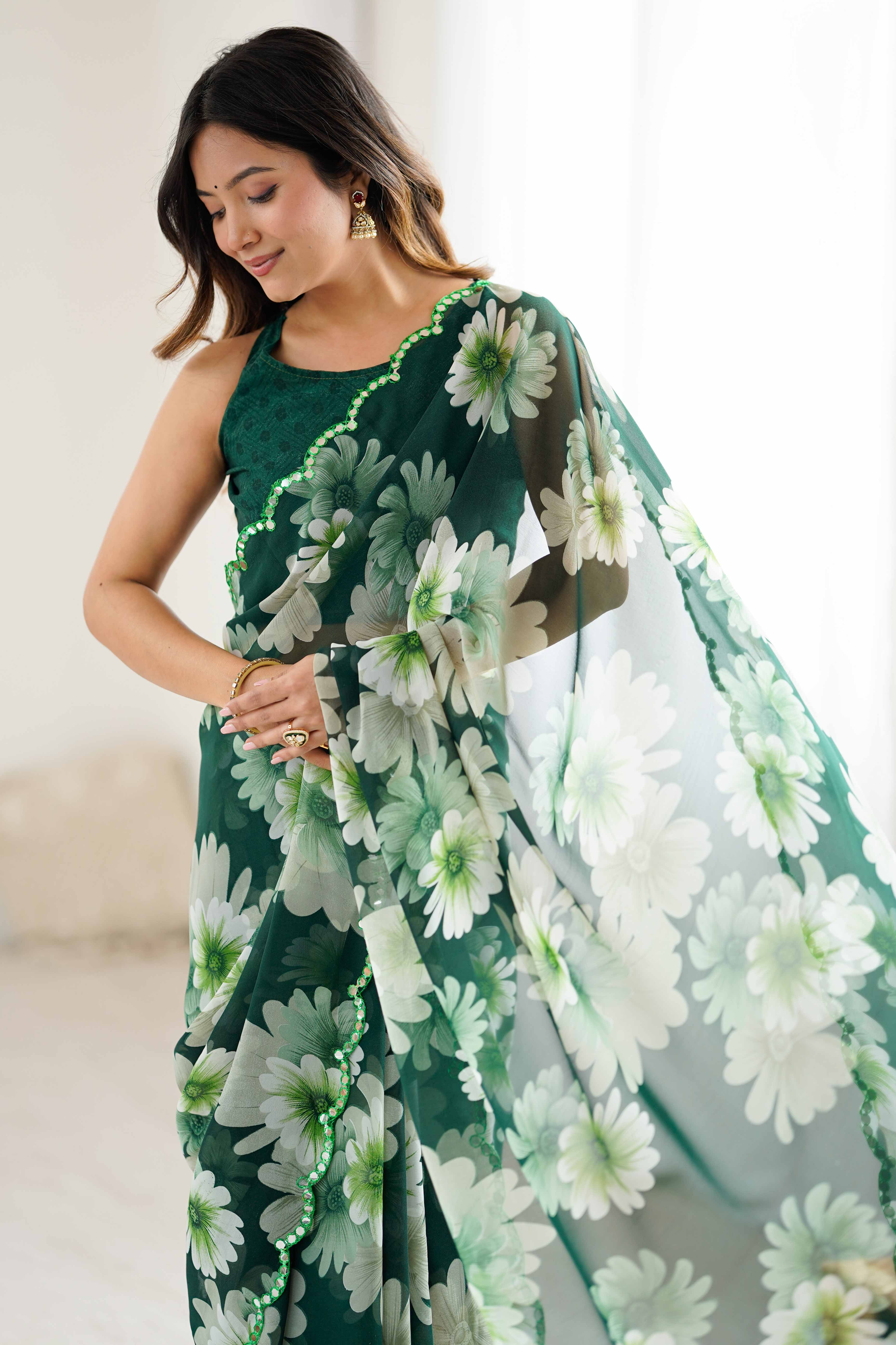Green Georgette Saree Featuring Floral Prints & Shimmering Mirror Work Border
