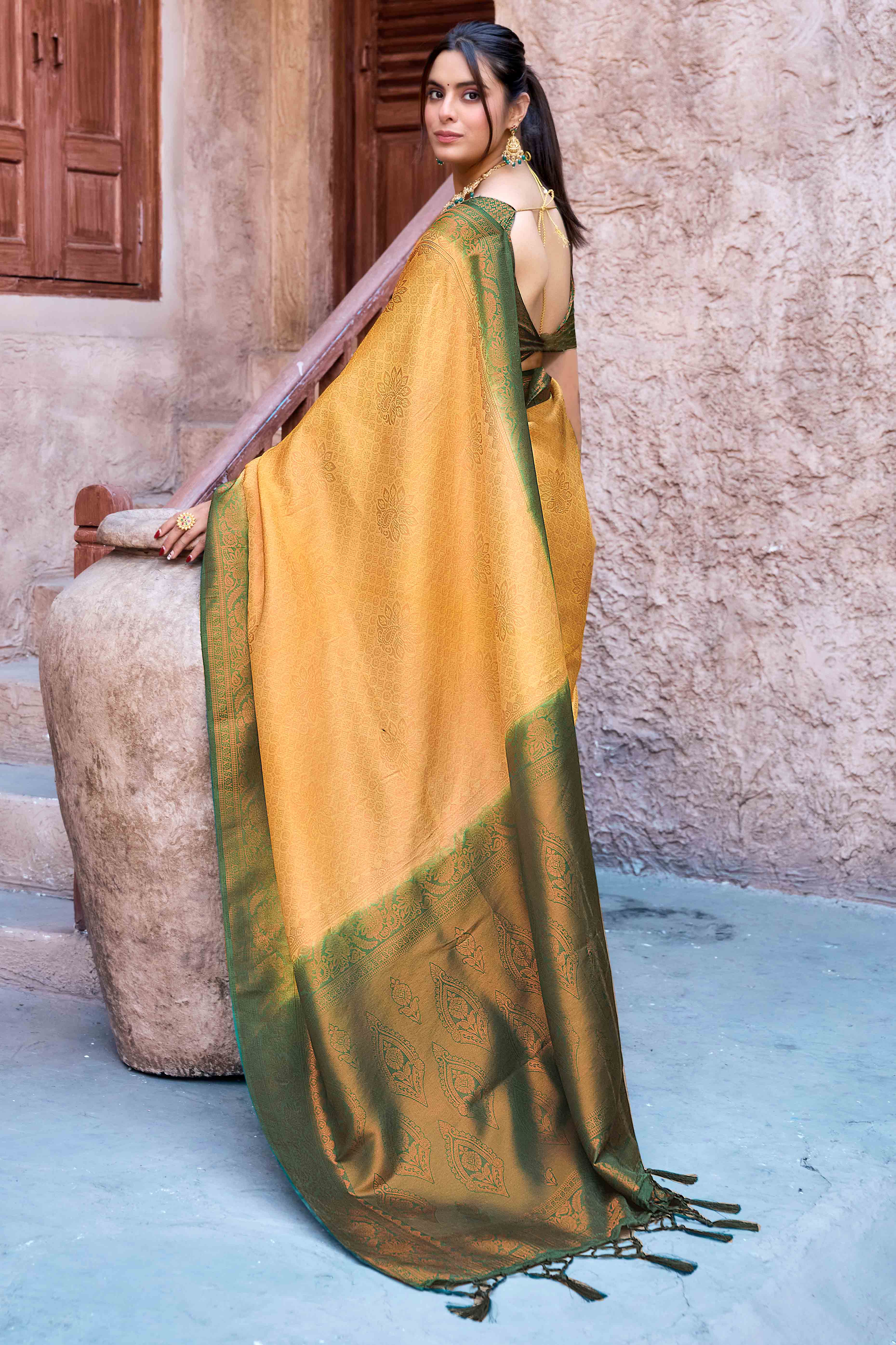 Mustard Banarasi Silk Saree Featuring Elegant Floral Woven & Delicate Tassel Edging