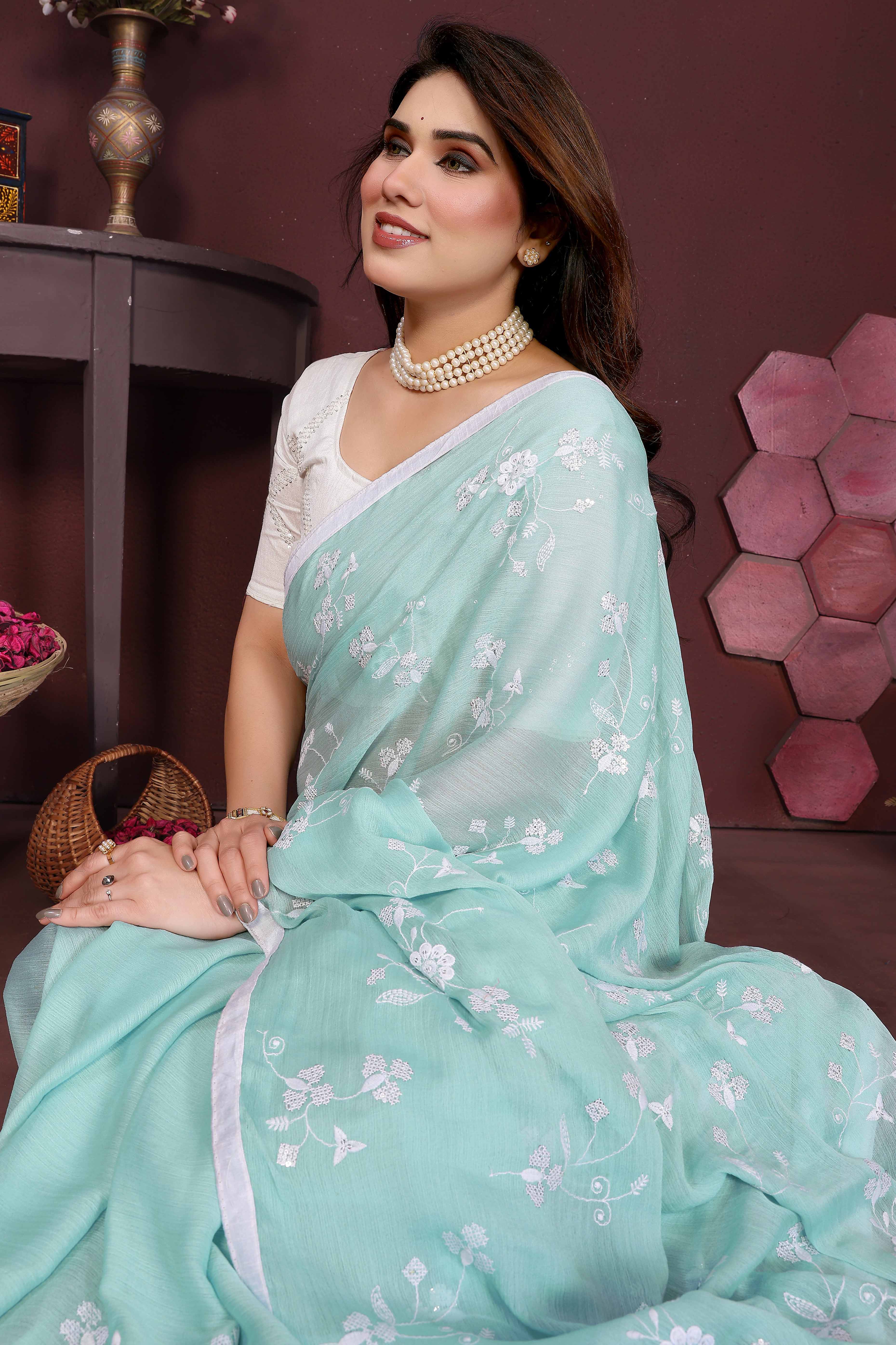 Pale Turquoise Bloom Saree adorned with Moss Floral Embroidery and Delicate Lace Border